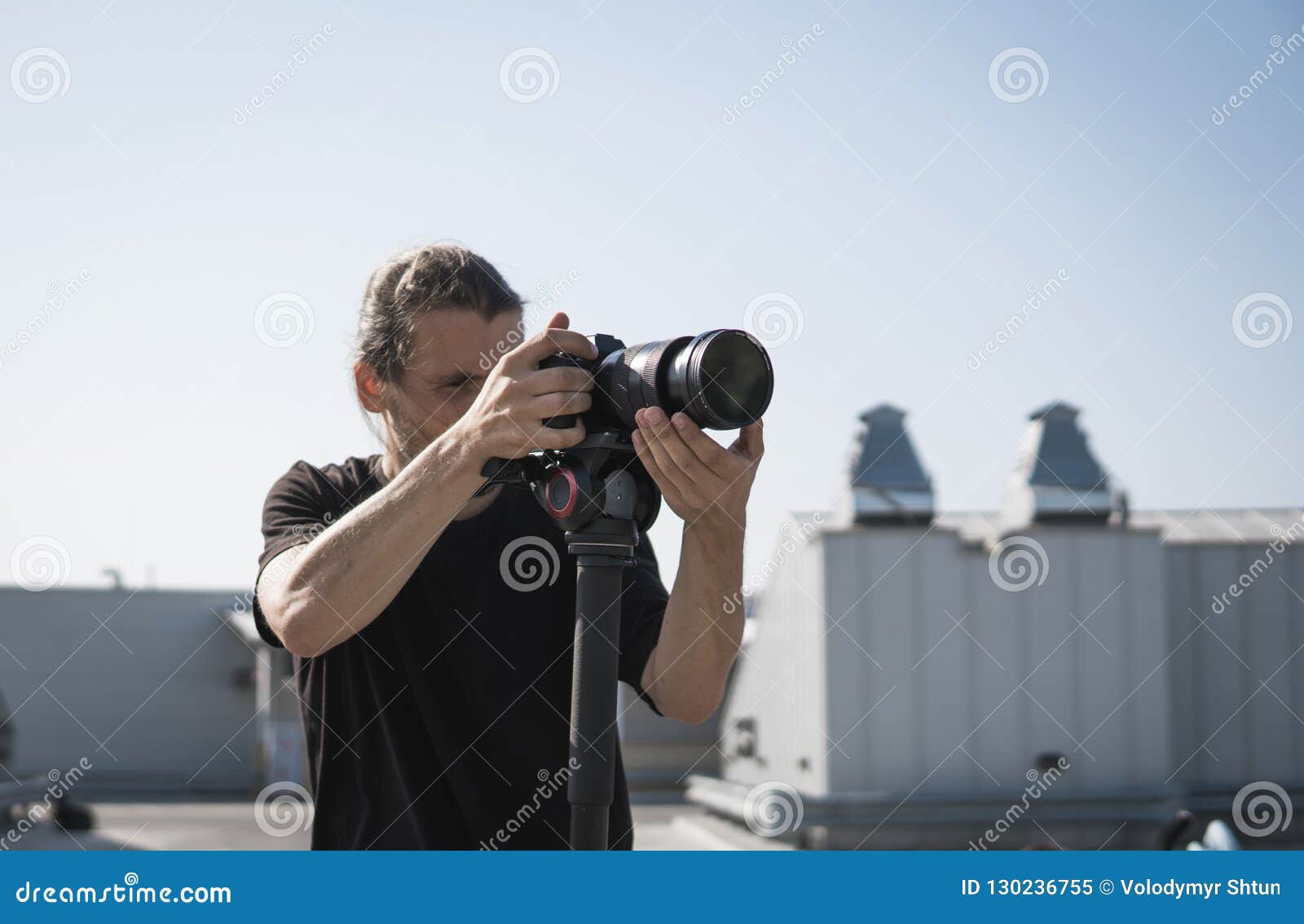 Professional Videographer Using Cinema Digital Video Camera. Stock