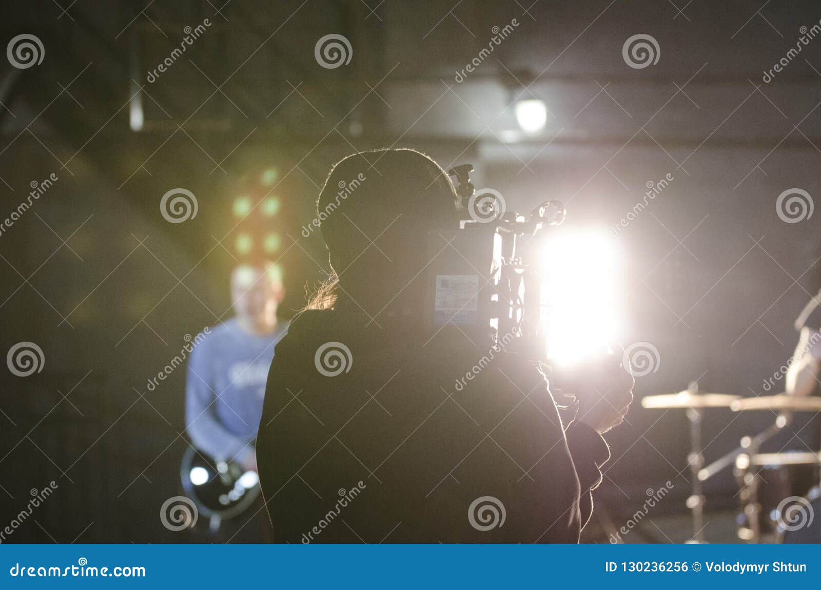 Professional Videographer Using Cinema Digital Video Camera for Filming