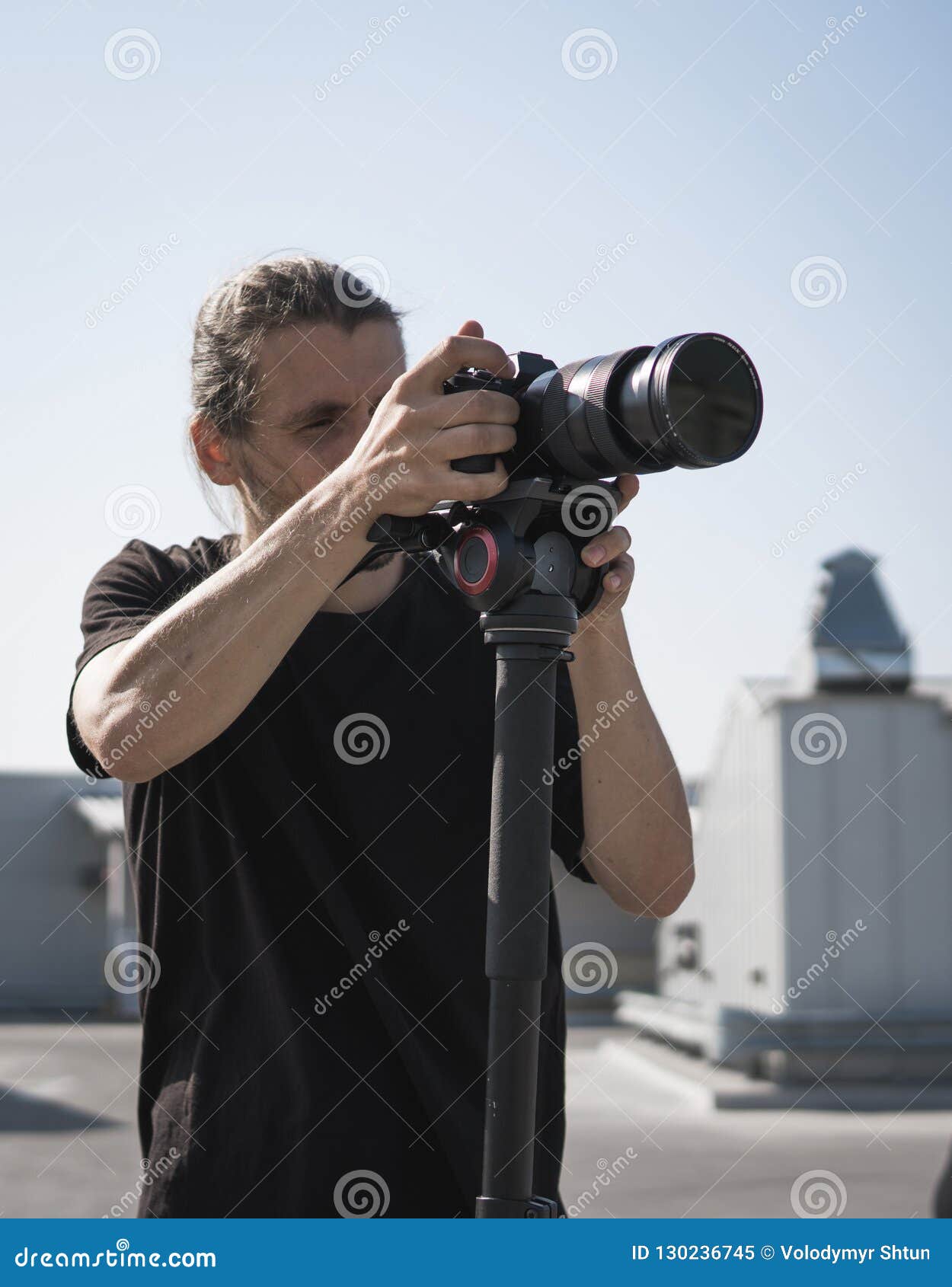 Professional Videographer Using Cinema Digital Video Camera. Stock