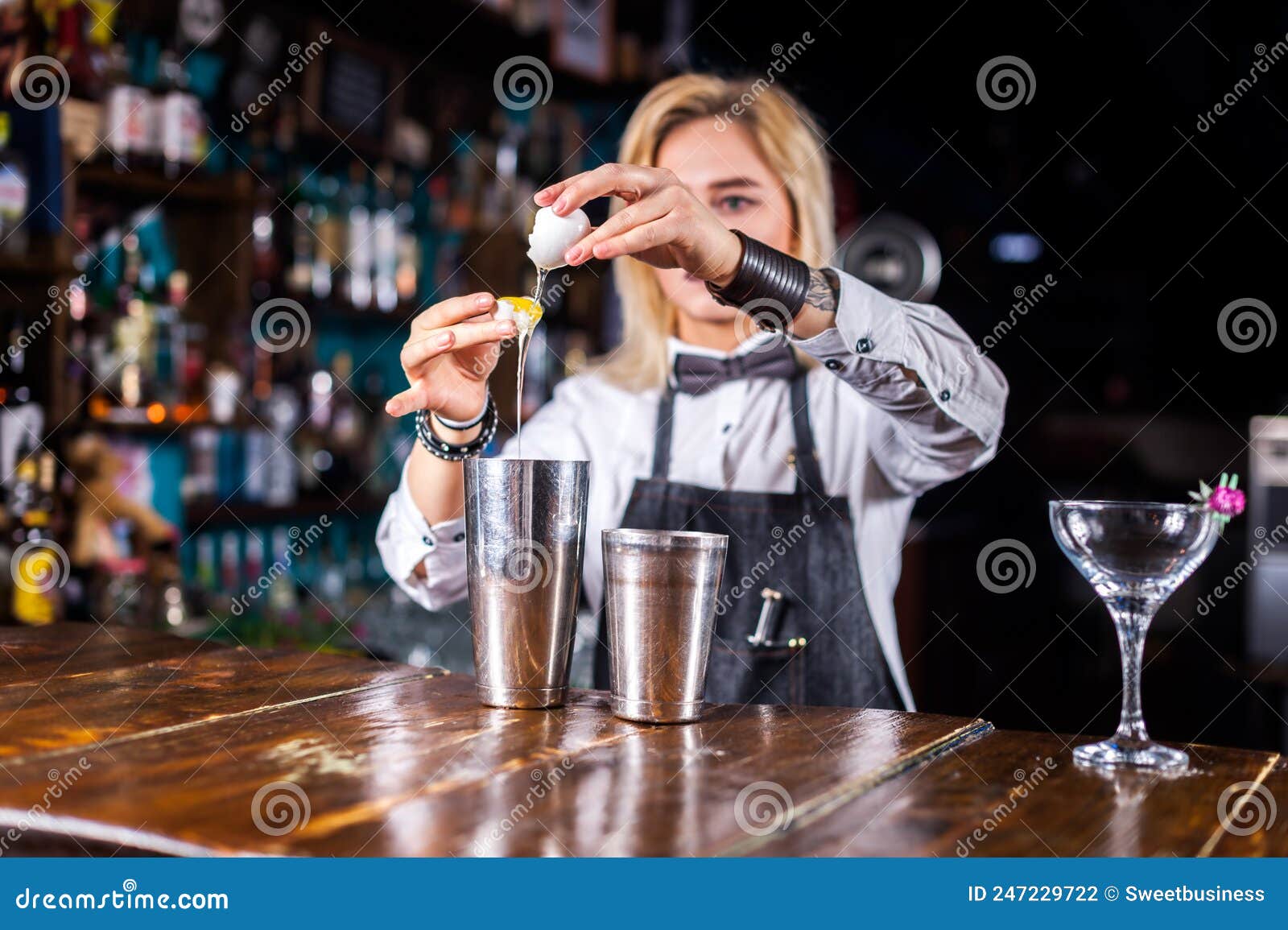 Professional Woman Barman Pouring Fresh Alcoholic Drink into the ...