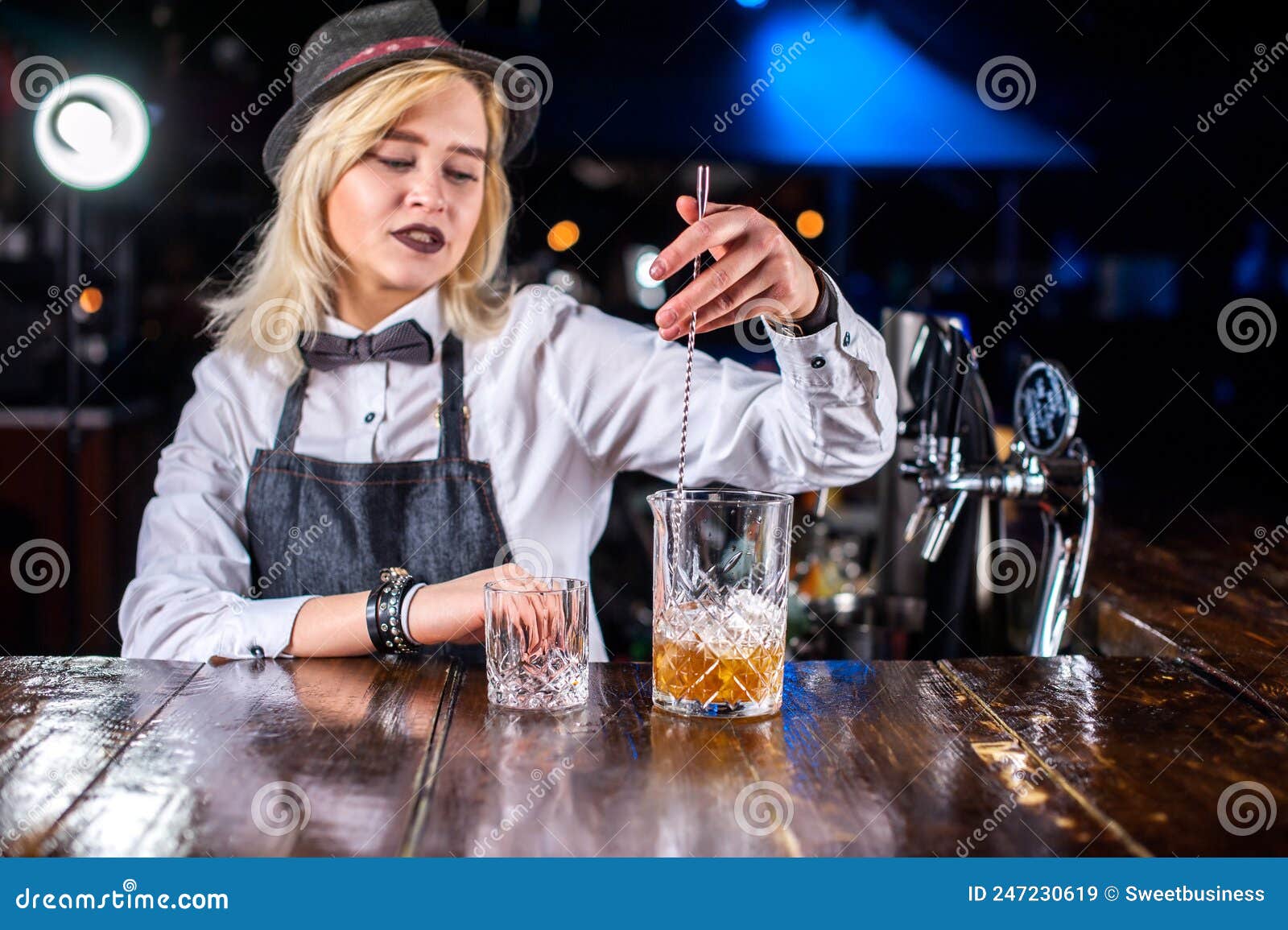 Portrait of Woman Barman Makes a Show Creating a Cocktail while ...