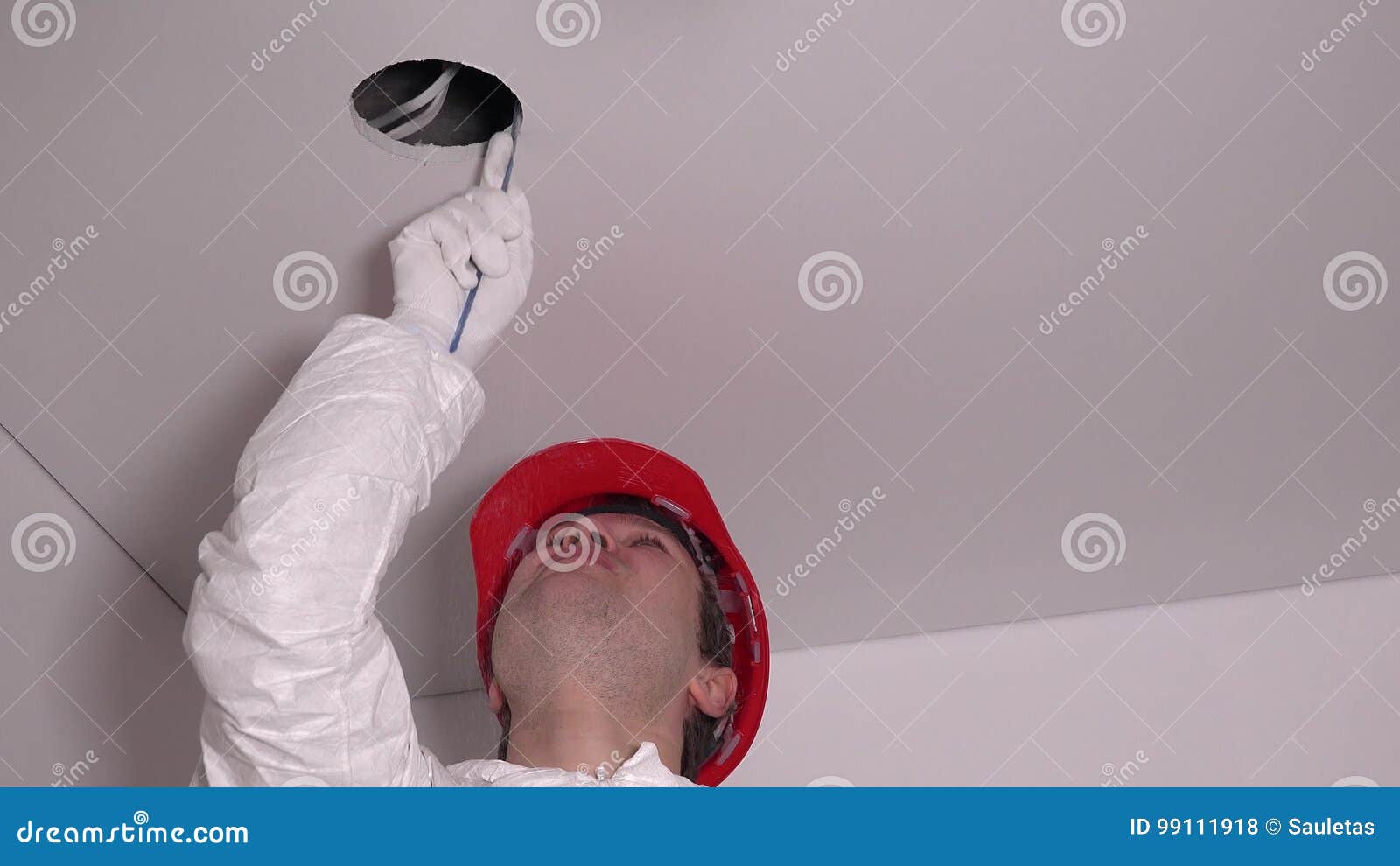 Professional Worker Man Make Drywall Ceiling Holes For Lighting Installation