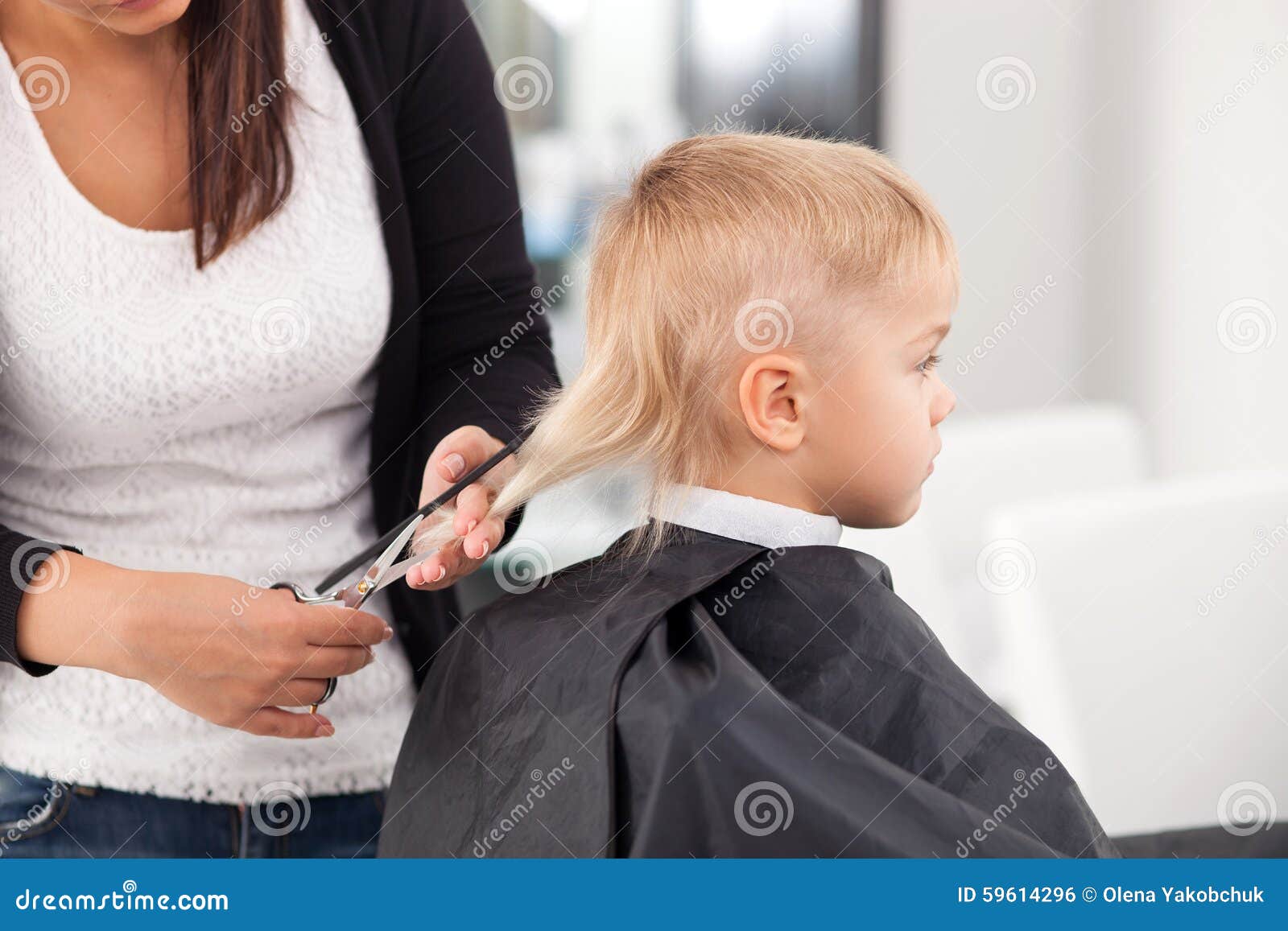 Professional Young Hairdresser Is Cutting  Hair  Of Stock 