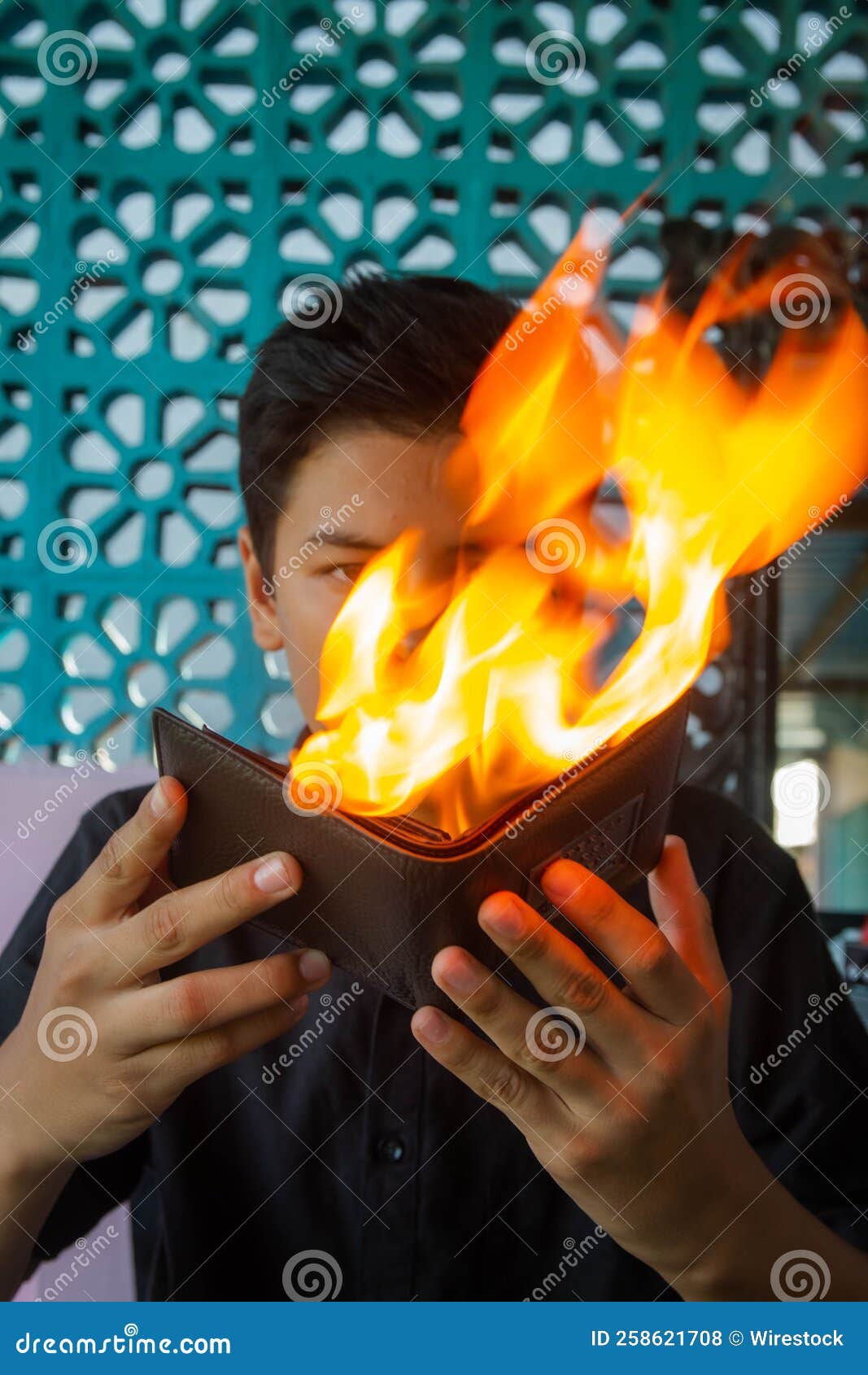 Professionals Fire Wallet Trick by an Asian Male Stock Photo Image