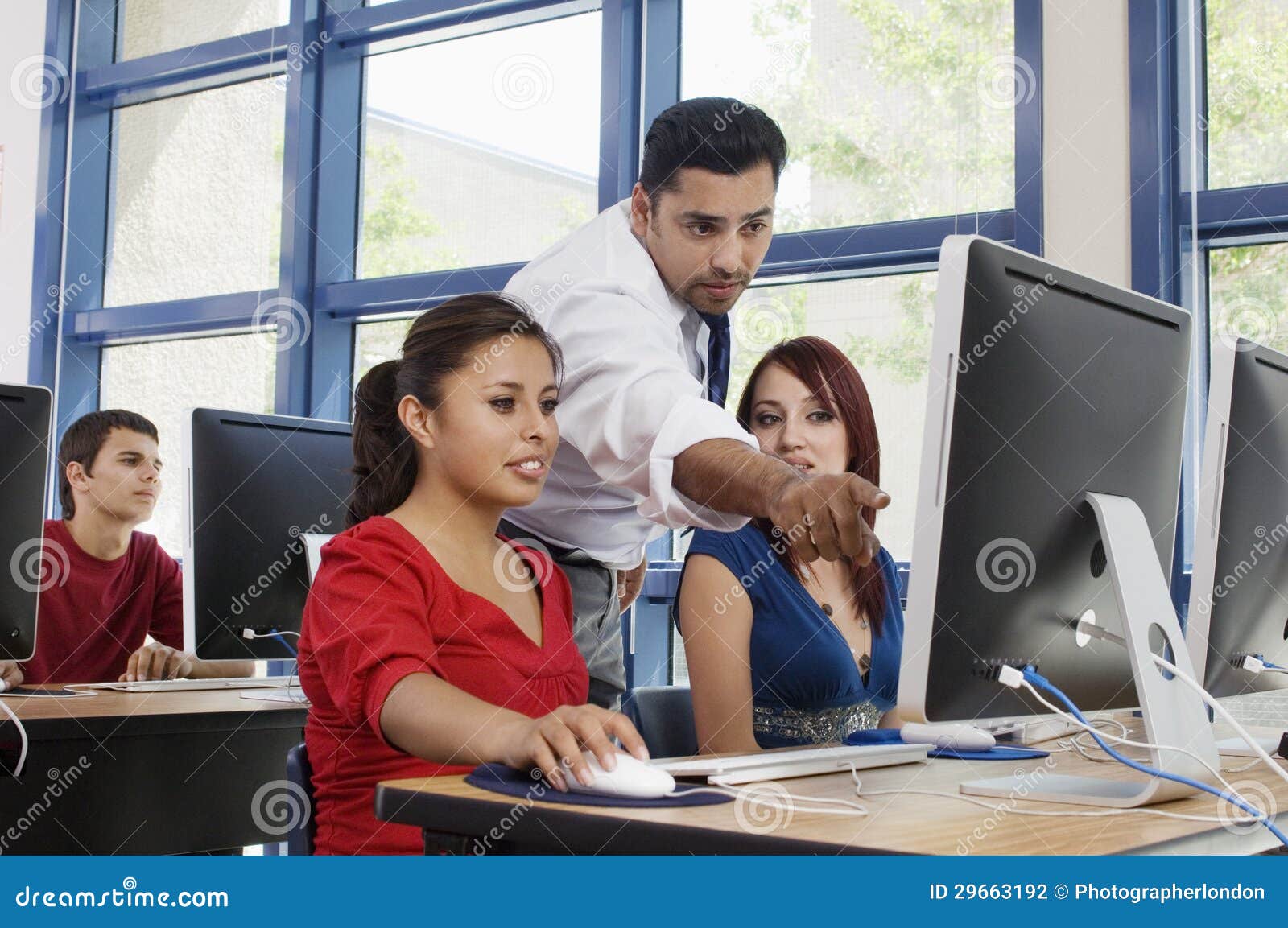 professor assisting students in class