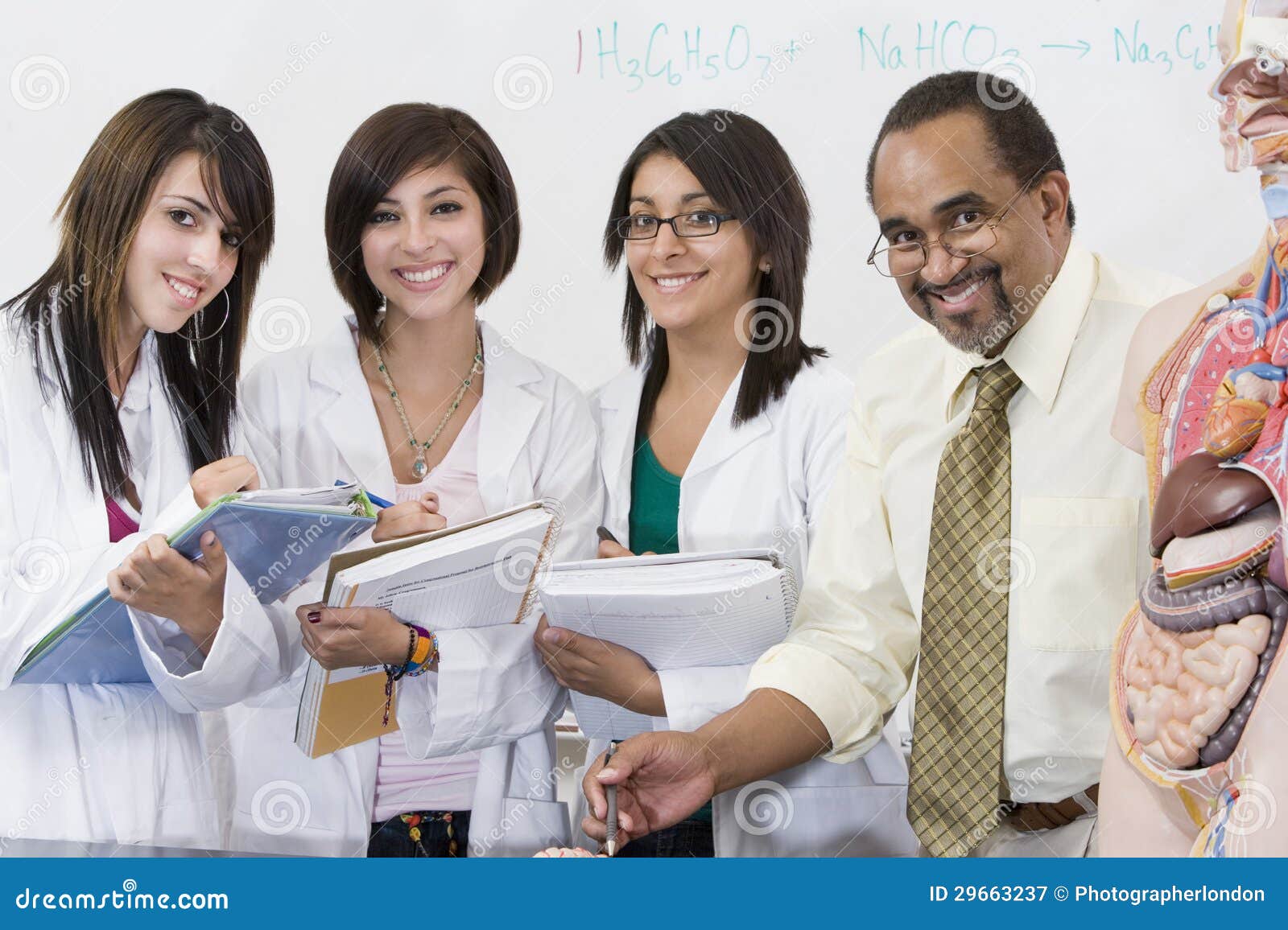 Professor with Female Students in Science Lab Stock Image Image of