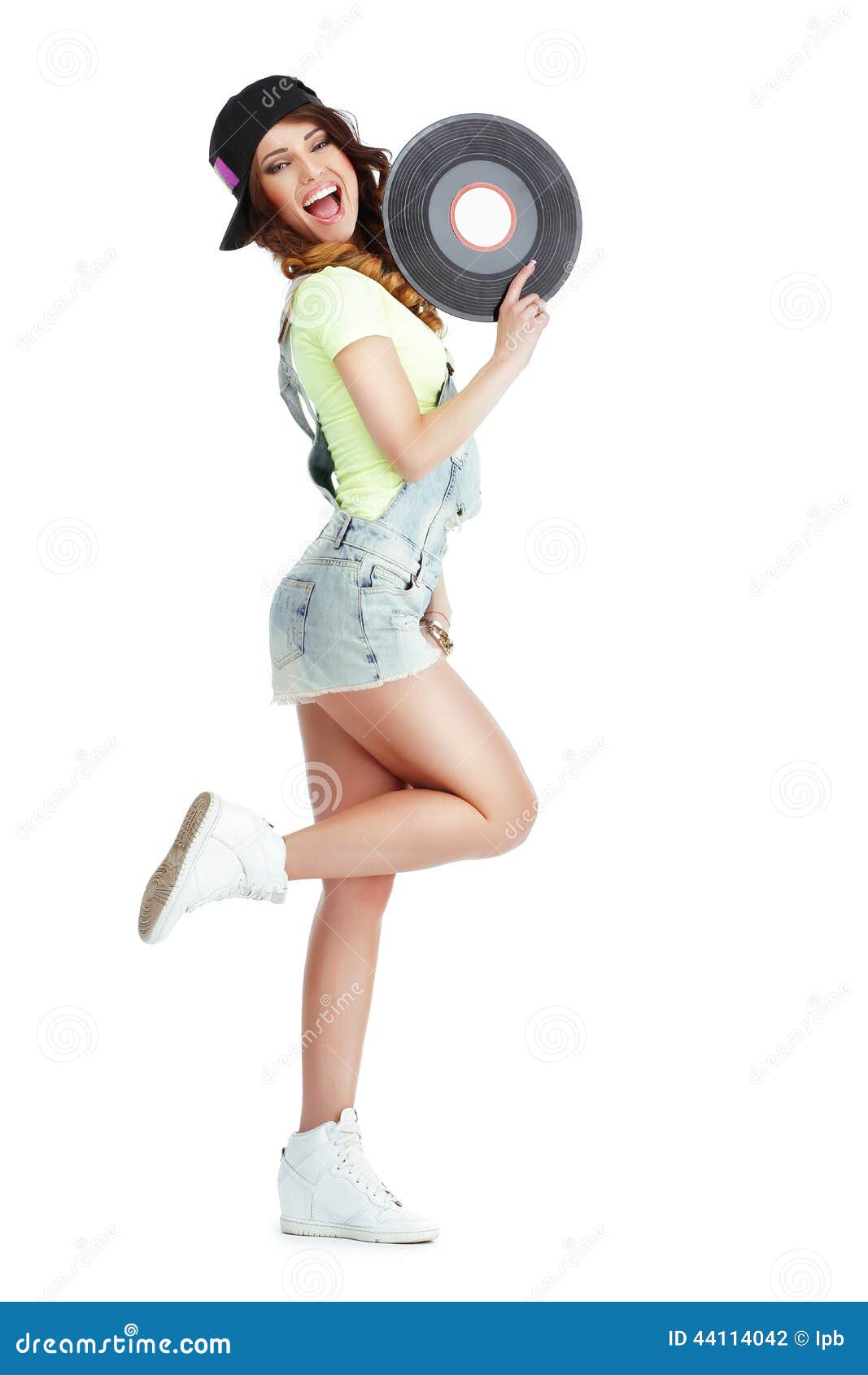 profile of elated jubilant woman with vinyl record  on white background