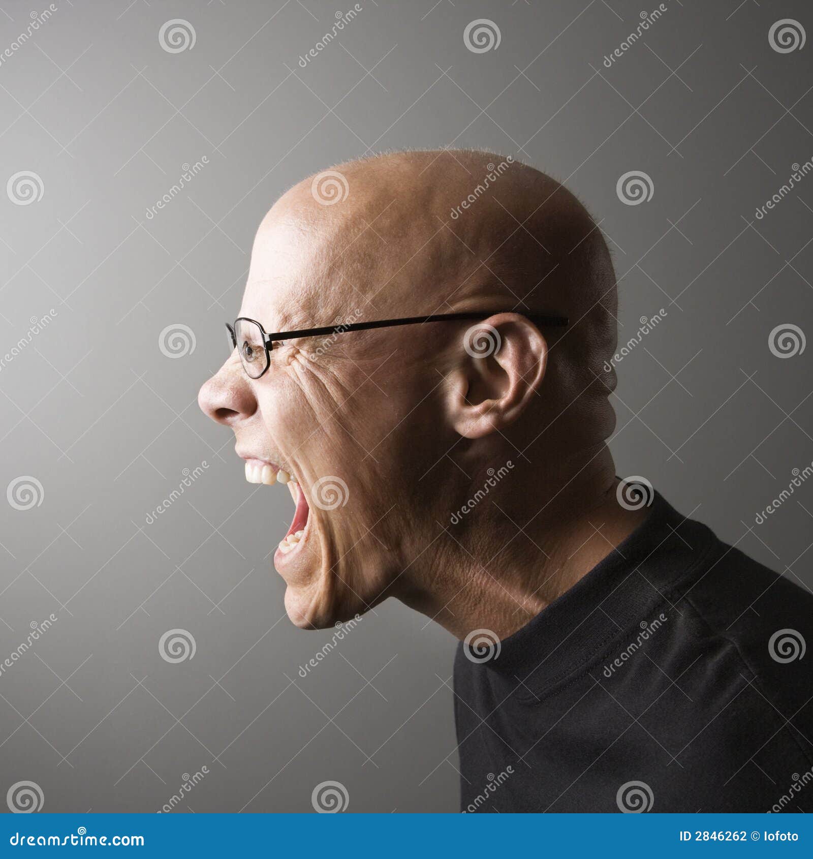 profile of man screaming.