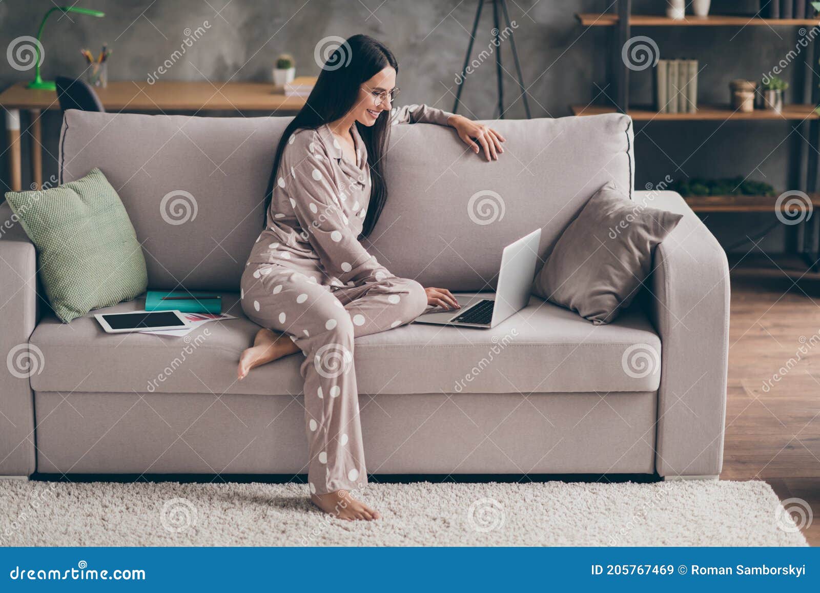 profile photo of pretty optimistic girl sit look write laptop wear spectacles pijama at home on sofa