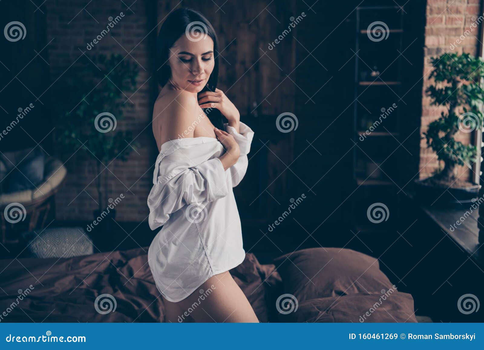 Woman Taking Off Shirt Bed Stock Photos - Free & Royalty-Free