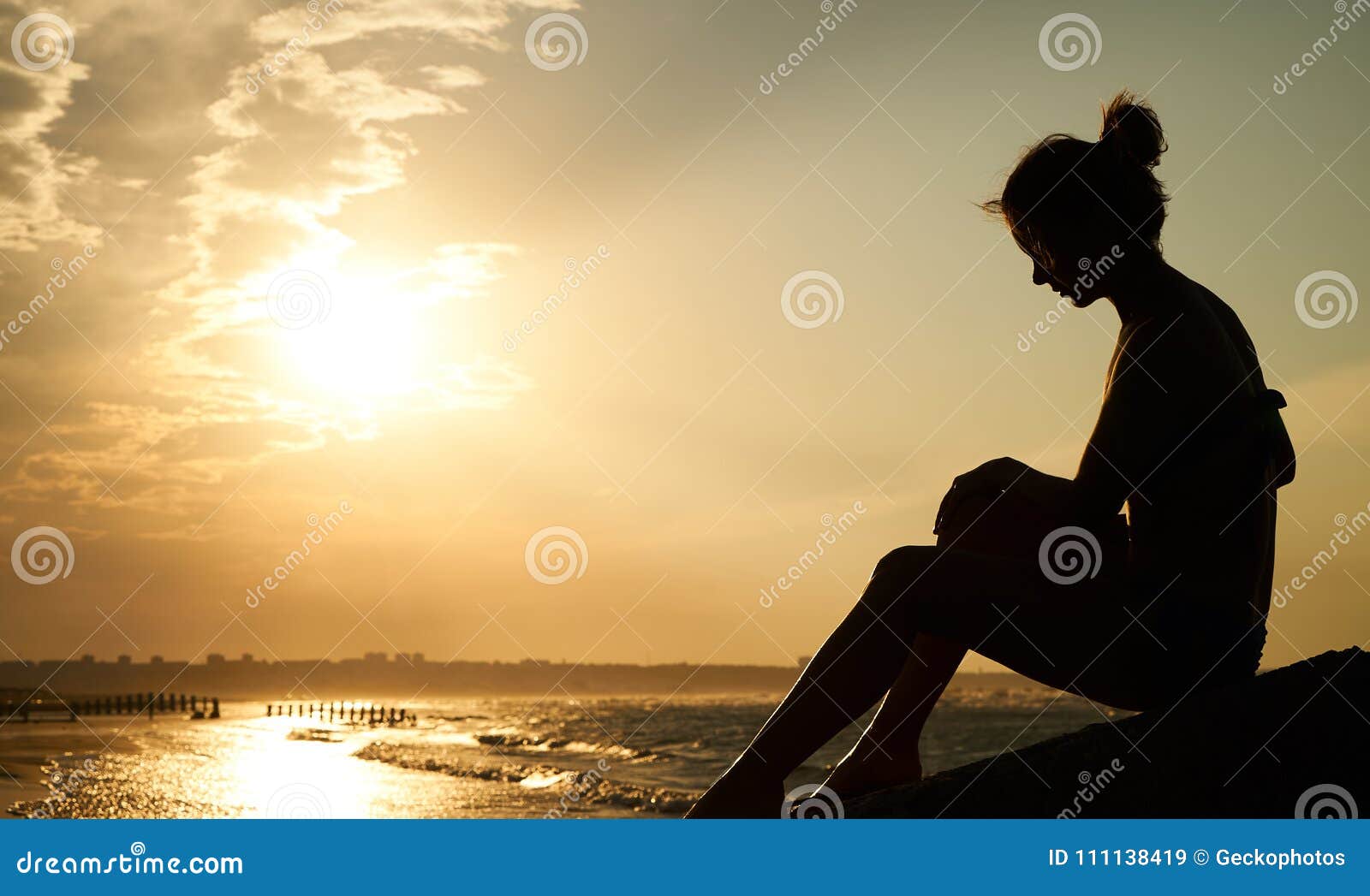 Profile of a Sad Young Woman Silhouette in Swimsuit Stock Image