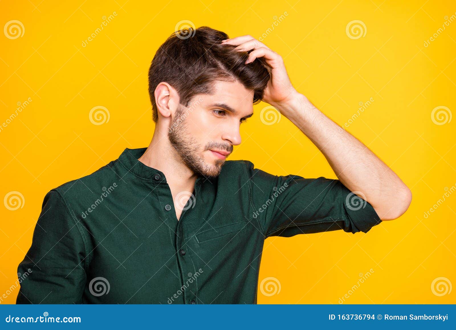 profile side photo of serious minded guy look in mirror touch his hair after new anti dander effect shampoo wear casual