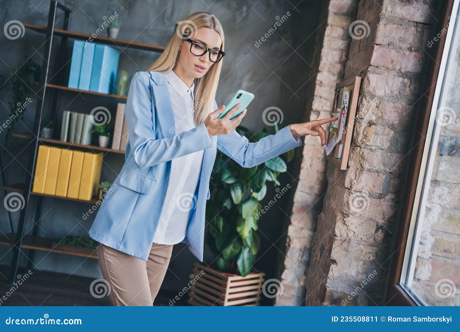 profile side photo of stupor boss lady look smart phone check partners appointment point finger noticeboard in modern