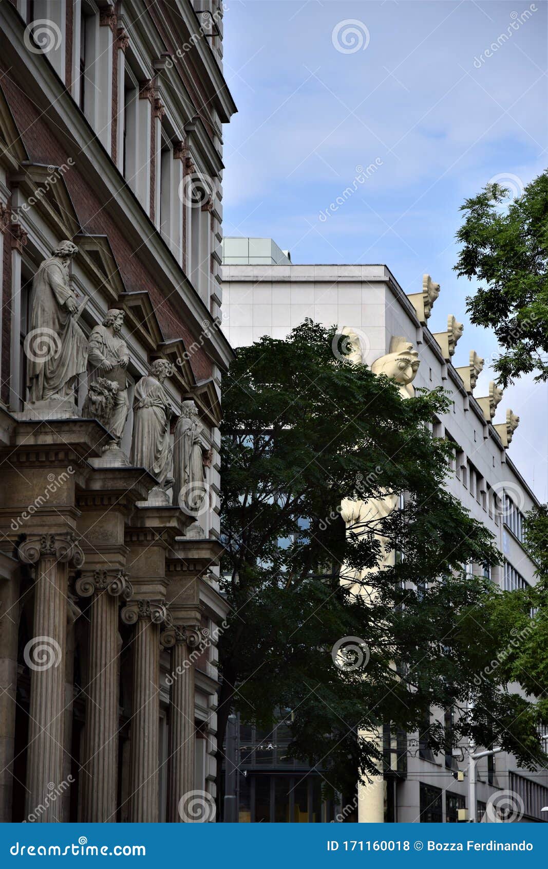 profile of two buildings, the first is techniche universitat wien, close to the beautiful church of san carlo borromeo in vienna.
