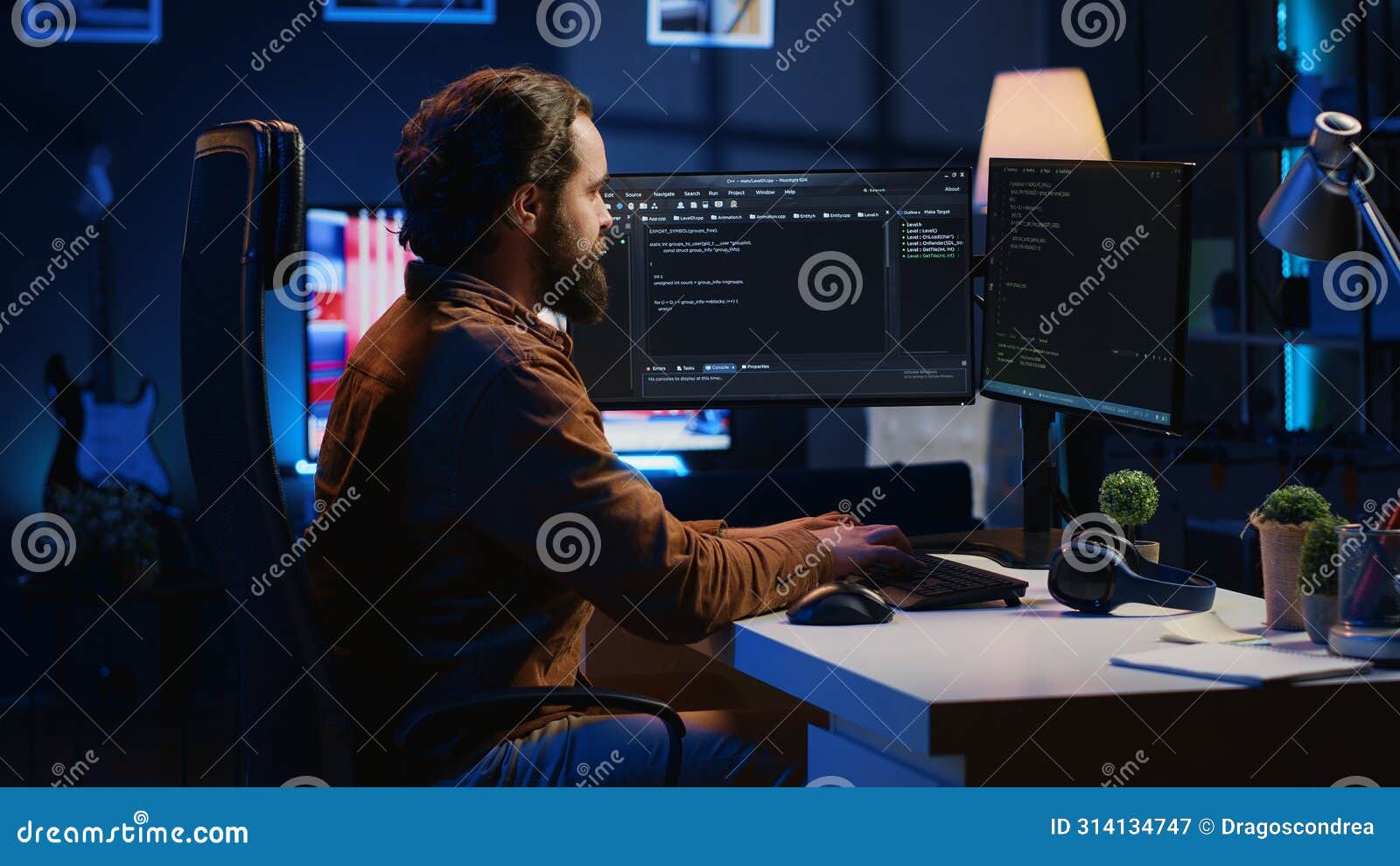 Programmer Developing Code on Computer Screen while in Personal Office ...