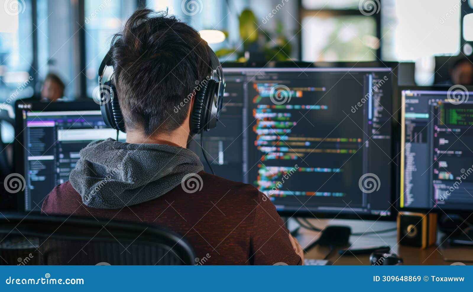 Programmer with Headphones Coding in Modern Office Stock Image - Image ...