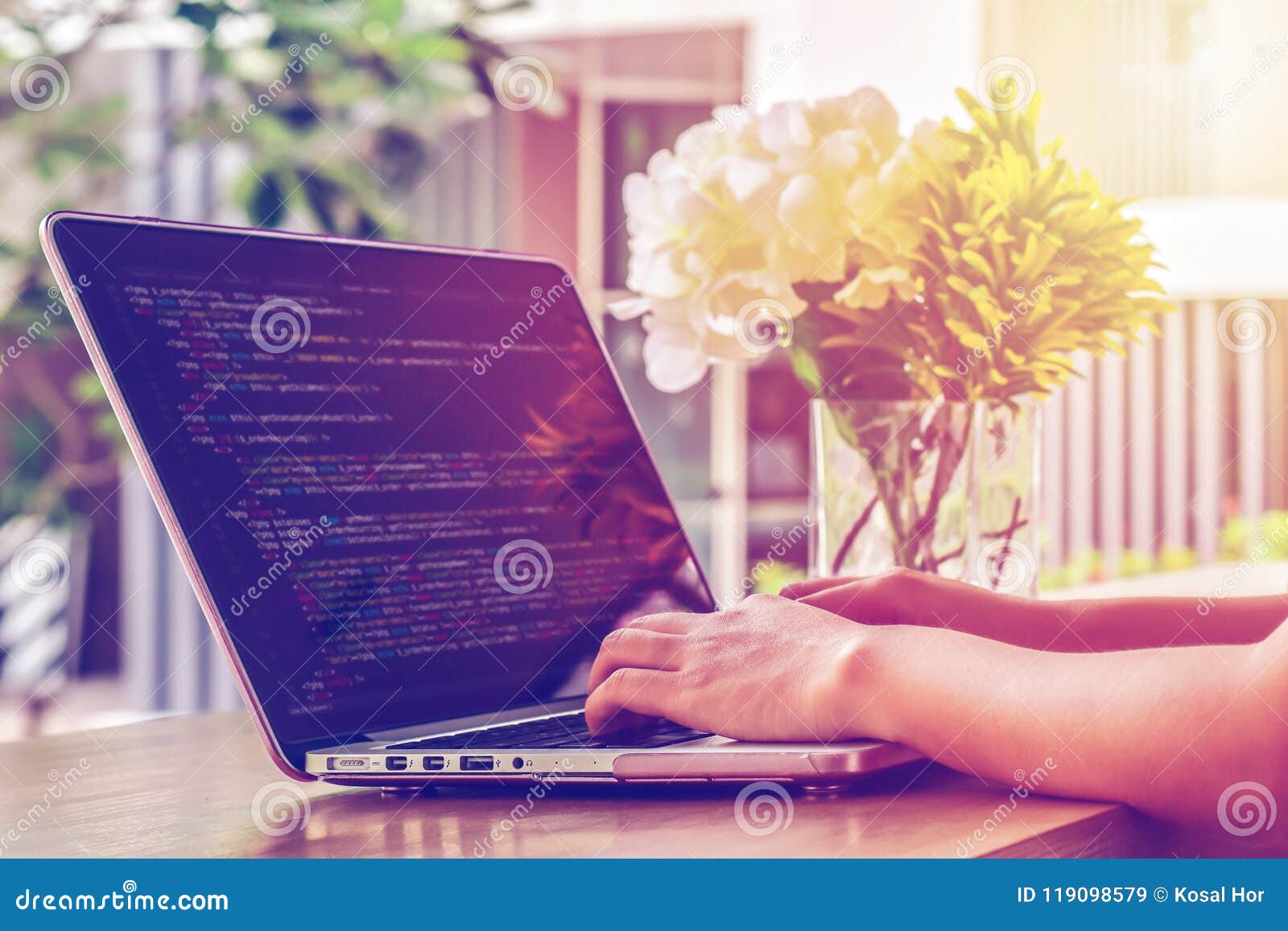 Close-up of Programmer`s Hands Working on Source Codes Over a Laptop on ...