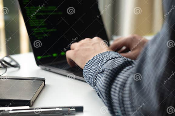 Programmer Working on Laptop at Office. Focus on Programming Code Stock ...
