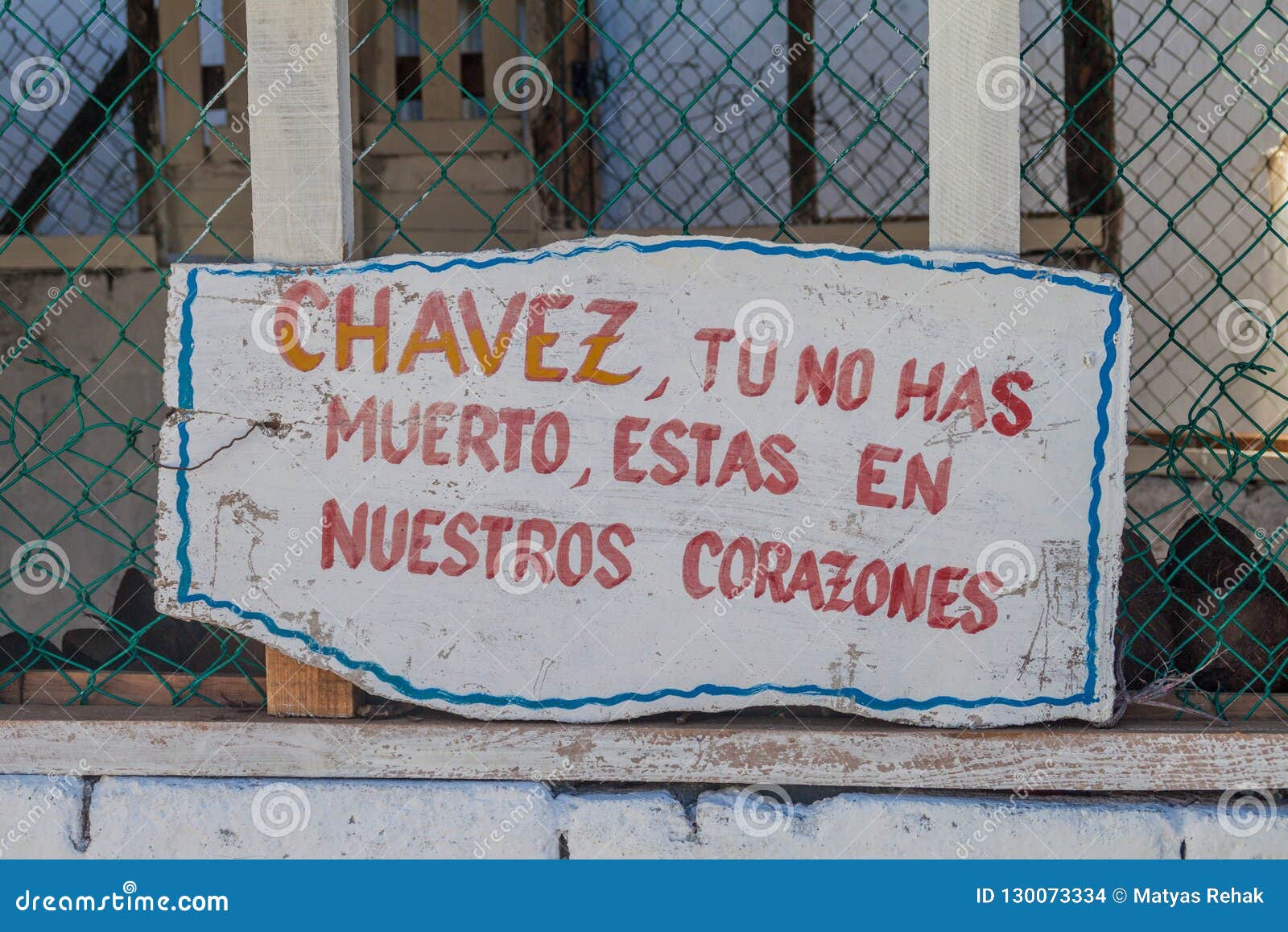 propaganda near baracoa, cuba. it says: chavez, you did not die, you are staying in ou heart