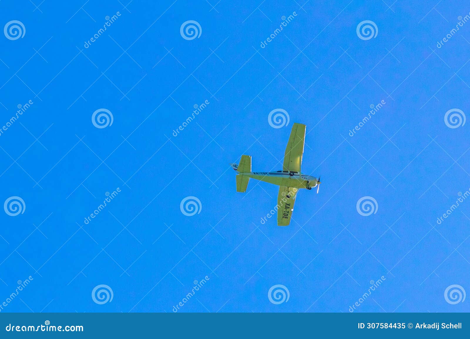 propeller plane aeronautics flies in the blue sky with clouds mexico