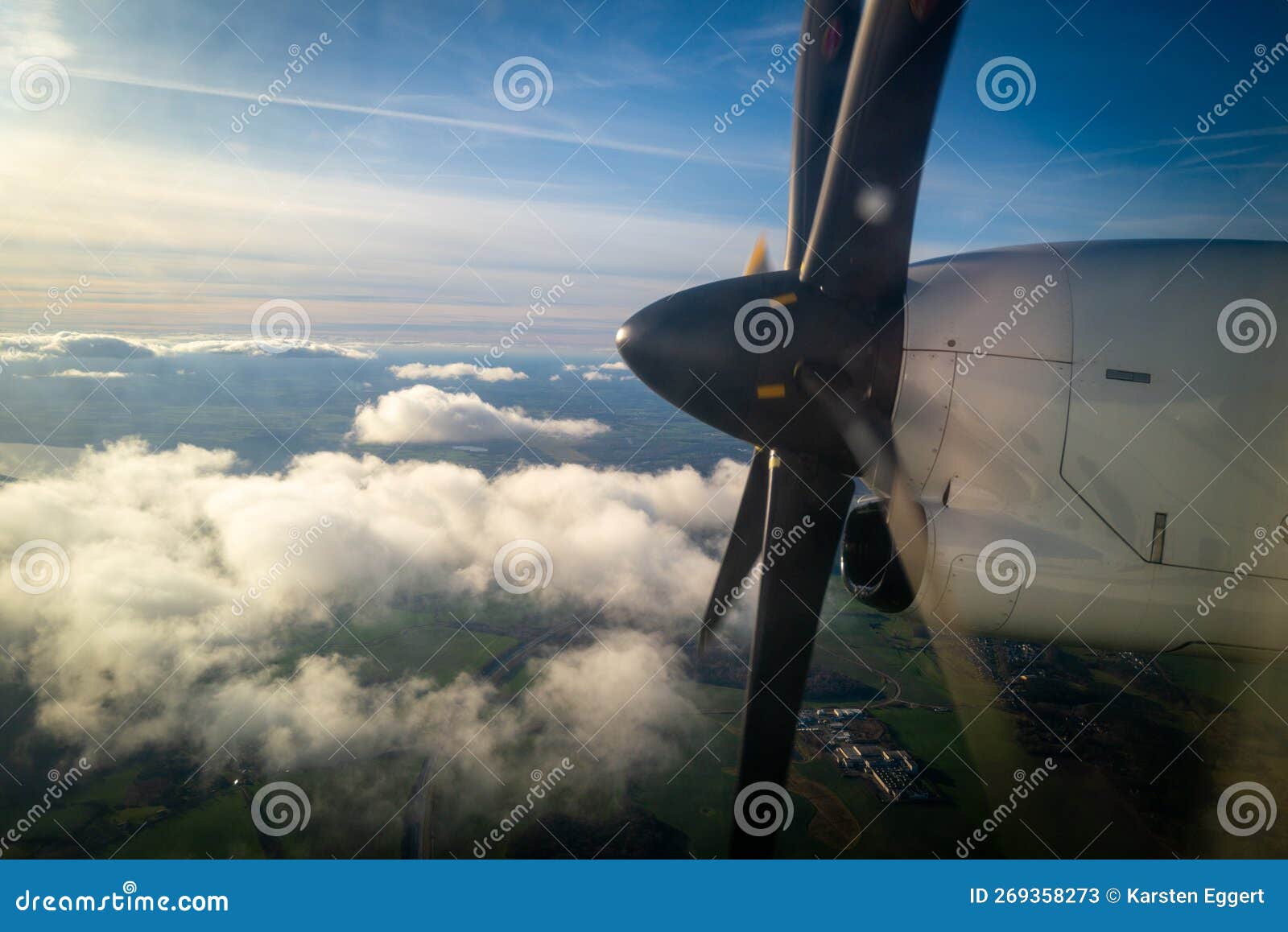 The Propeller of a Propeller Plane Flying Above the Clouds Stock Image