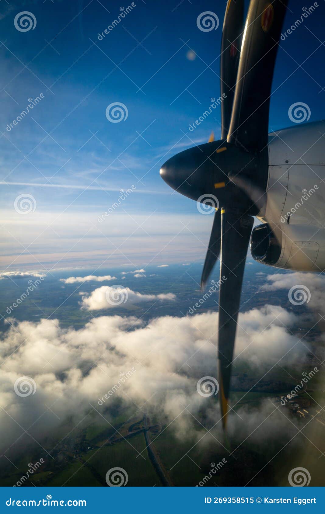 The Propeller of a Propeller Plane Flying Above the Clouds Stock Image