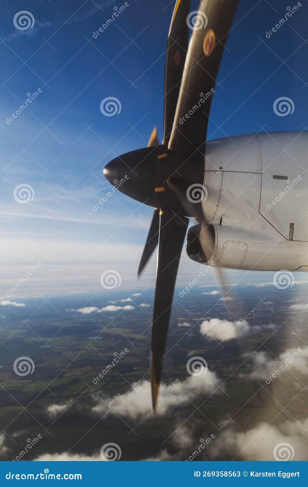 The Propeller of a Propeller Plane Flying Above the Clouds Stock Image