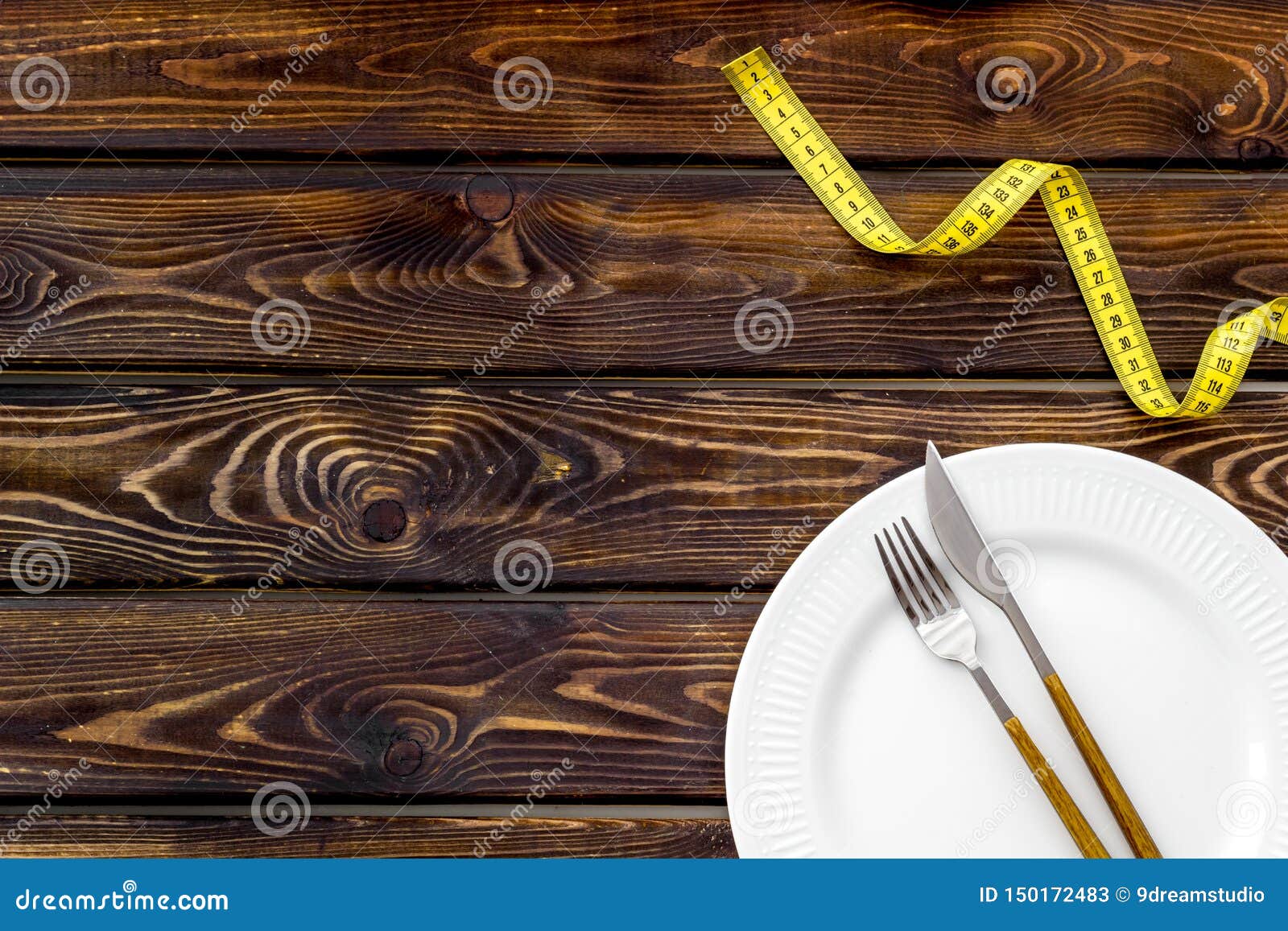 Download Slim Concept With Plate, Flatware And Measuring Tape On Wooden Background Top View Mockup Stock ...