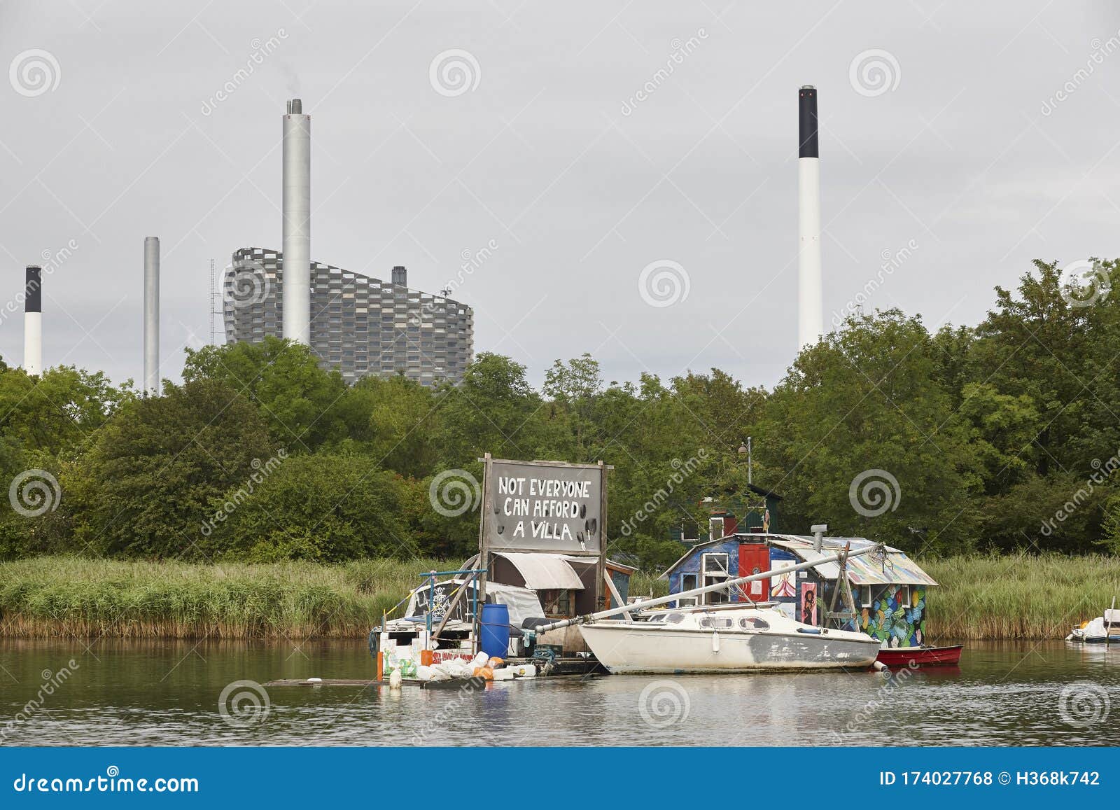 property speculation. boat houses in copenhague canals. affordable residential