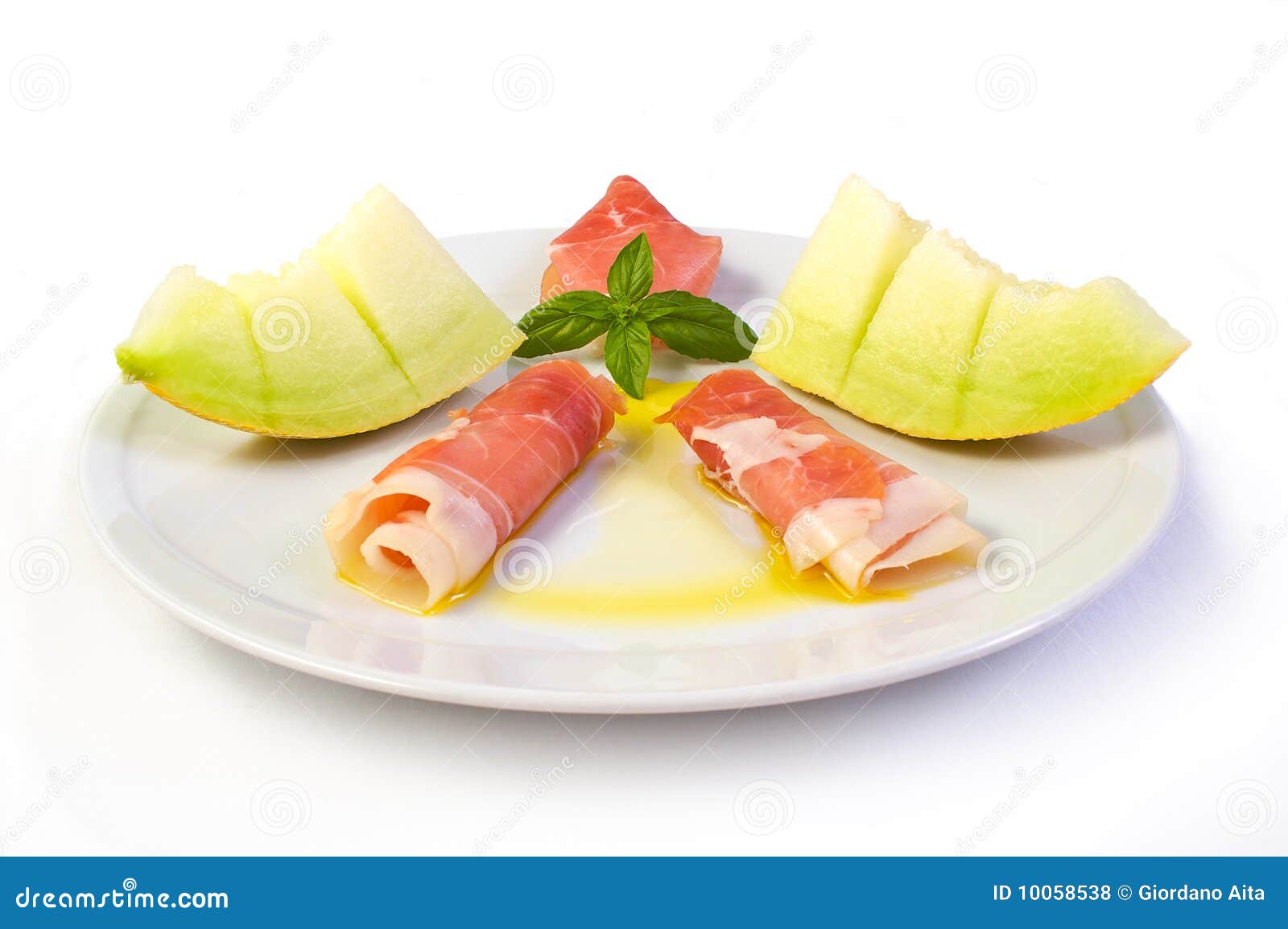 Prosciutto Grezzo E Melone Giallo Fotografia Stock Immagine di olio