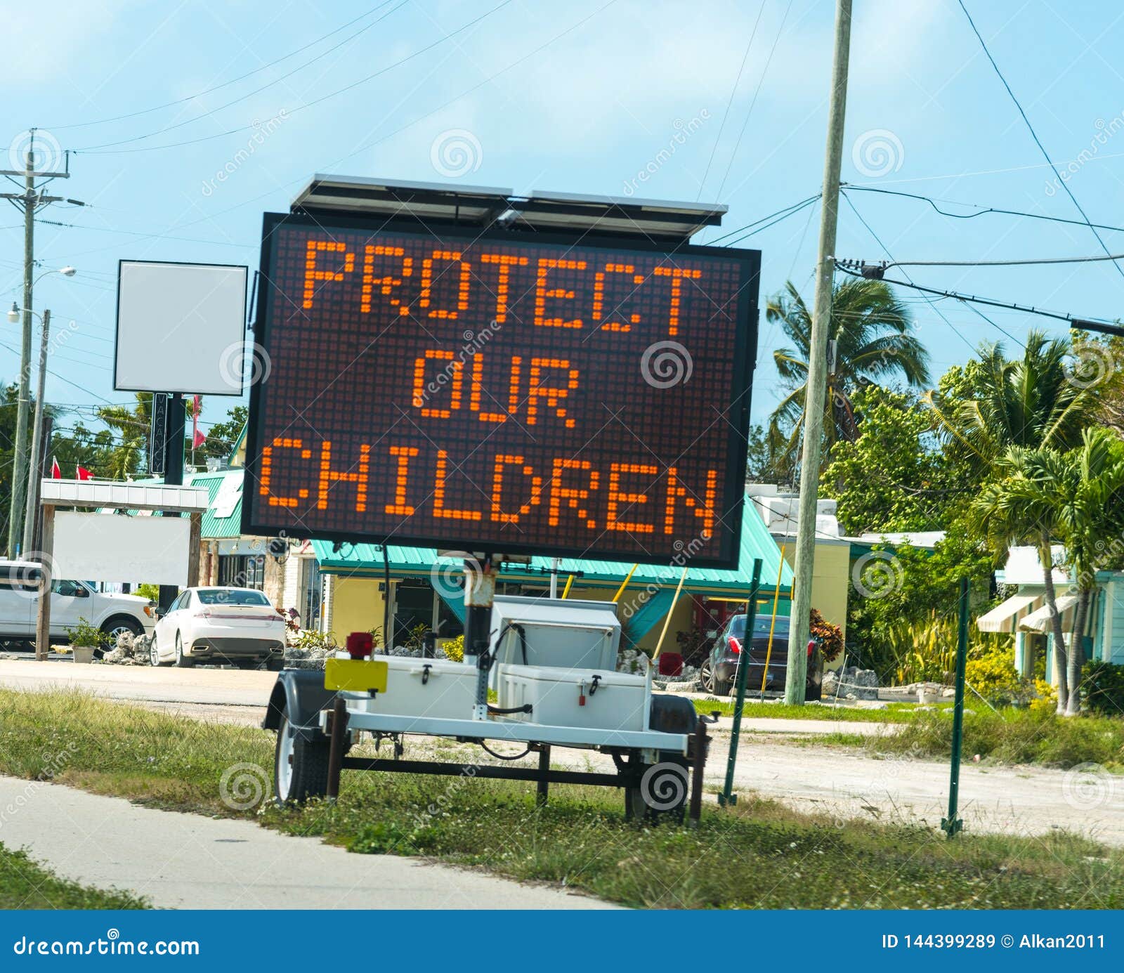 protect our children sign on the edge of the road