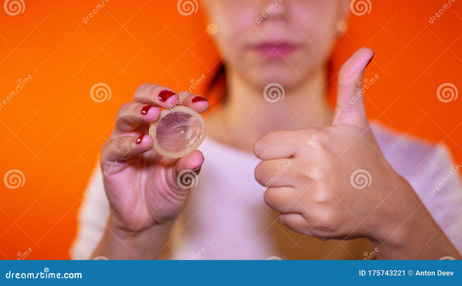 Woman Holding Condom Prevent Pregnancy Is Her Hand Holding An Open 