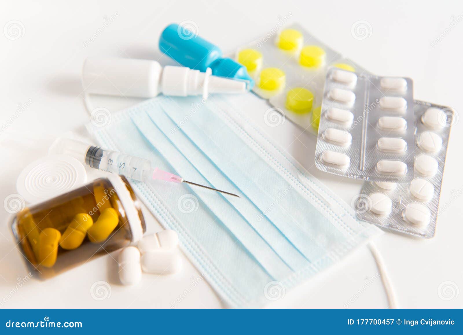 protective surgical mask,spray, pills, drops and syringe on white background.