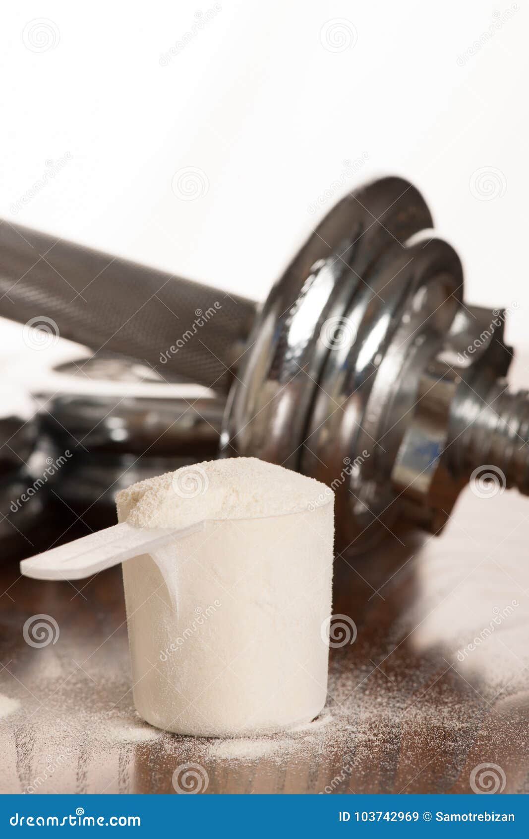 https://thumbs.dreamstime.com/z/protein-powder-scoope-dumbbells-background-whey-protein-powder-scoope-dumbbells-background-whey-103742969.jpg