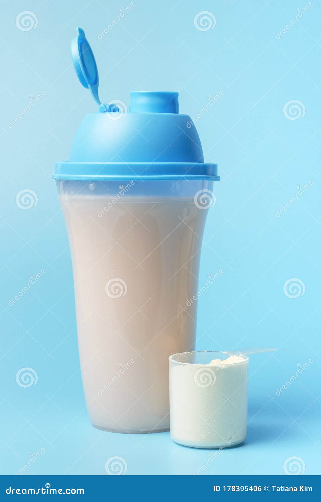 A Protein Shake and a Scoop on Blue Background, Front View Stock Photo Image of creatine