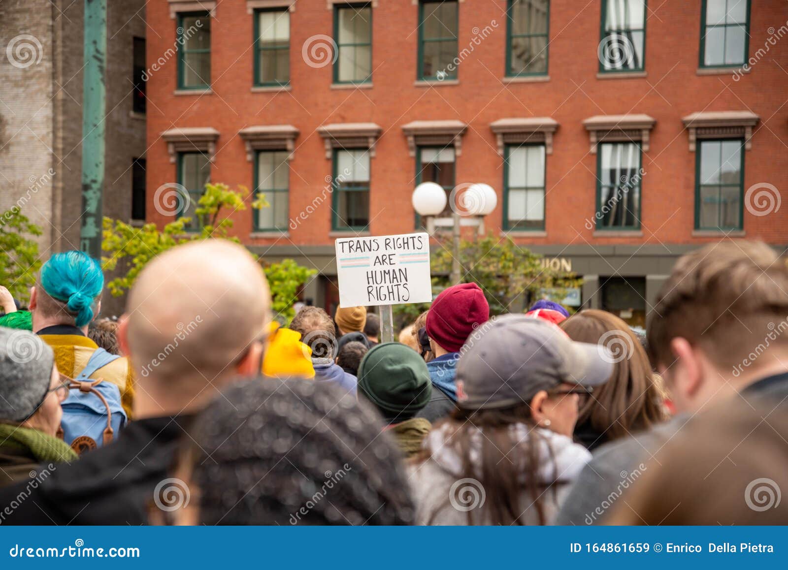 Protester Marching for a Peace Pride Rainbow Flag at the Boston March