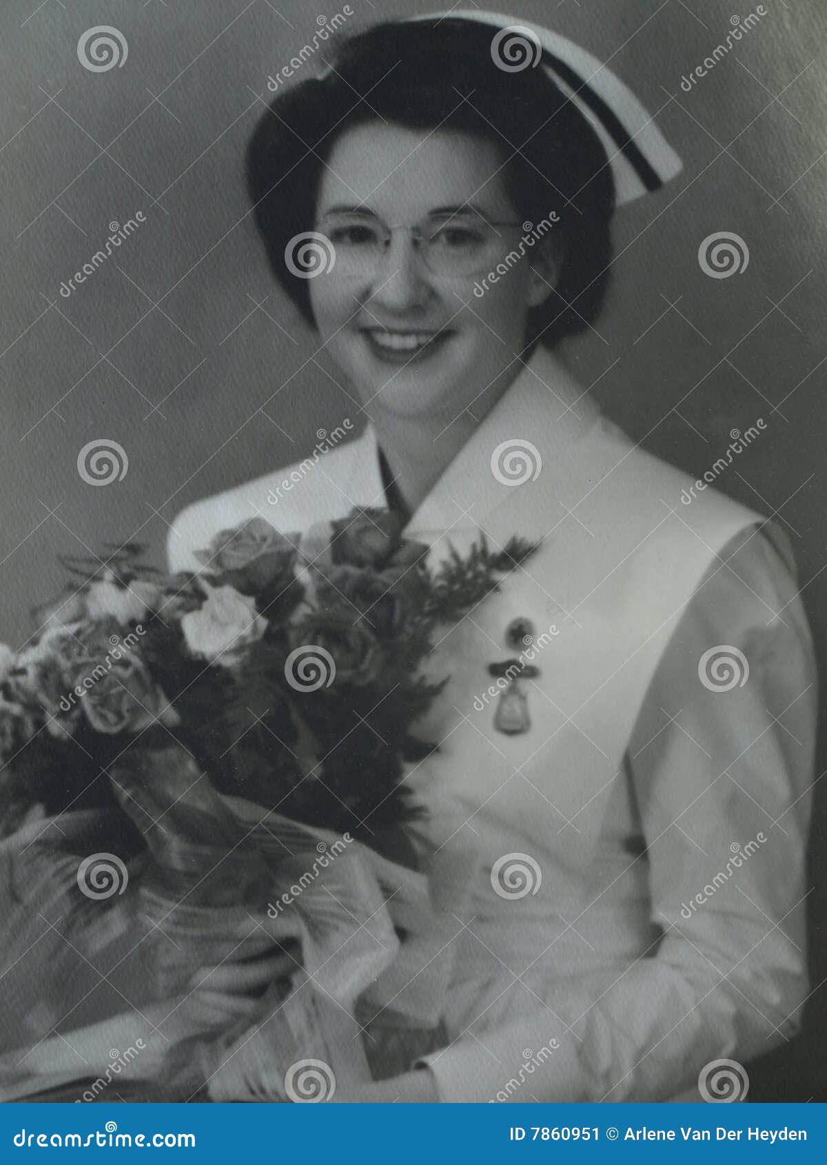 Proud nurse. This lady has had her training and graduated and is a full fledged nurse circa 1950.