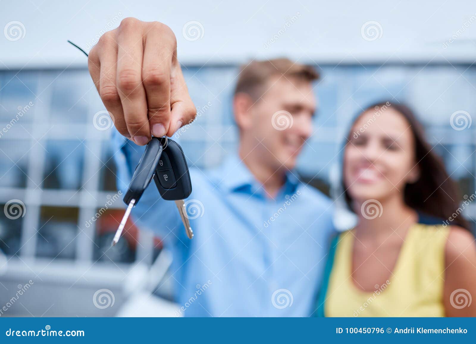 the family bought a new car in the showroom. the concept of buying a new car.