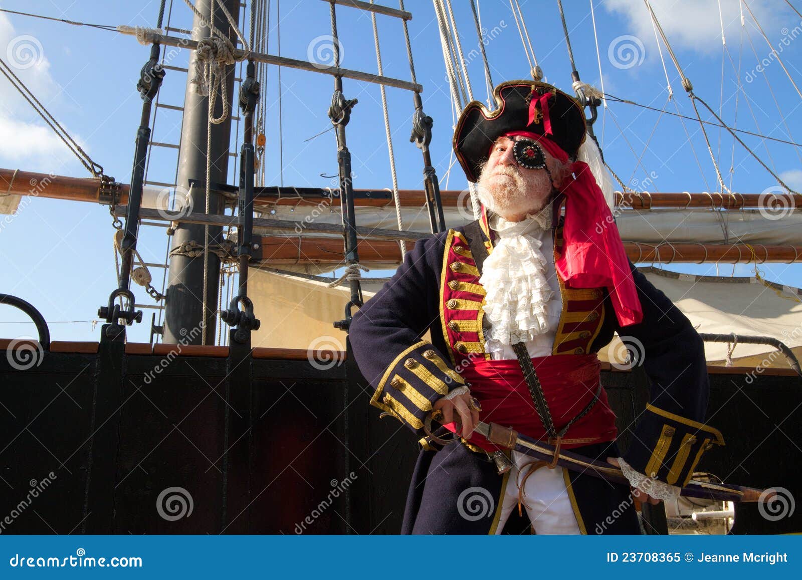proud pirate with pirate ship royalty free stock photo