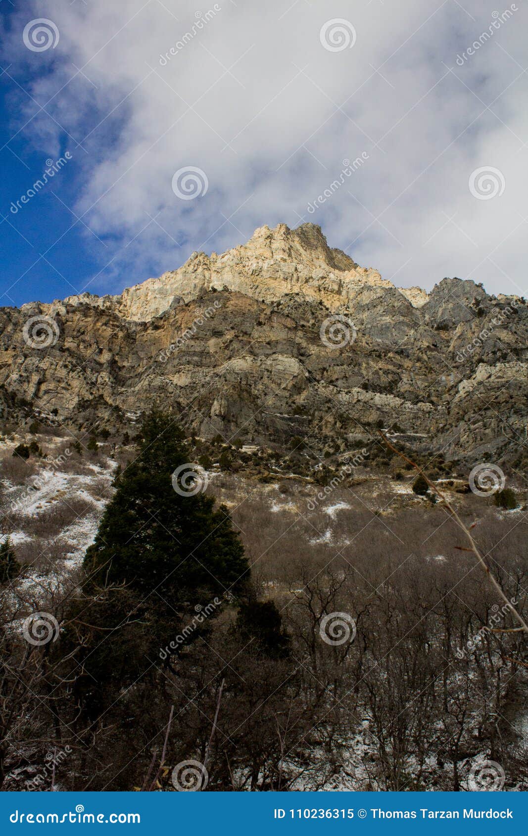 mountain peaks up rock canyon on the wasatch mountain range from crag to snow whisped summits