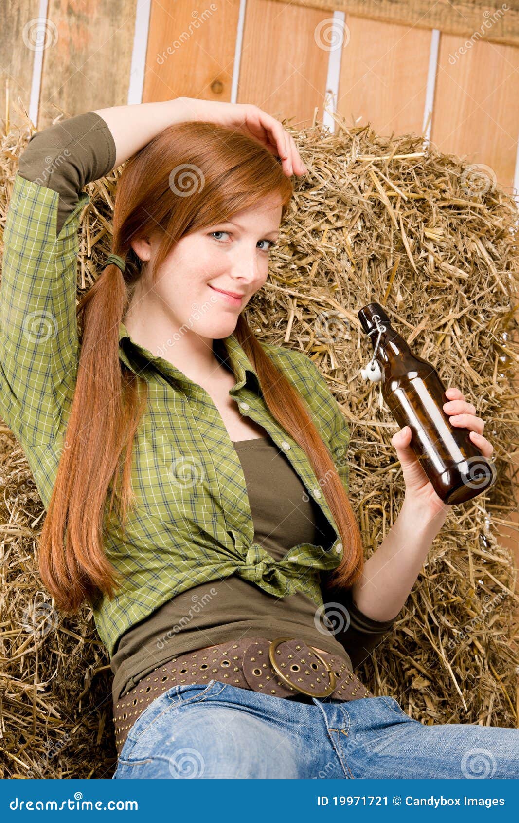 Provocative Young Cowgirl Drink Beer In Barn Stock Image 