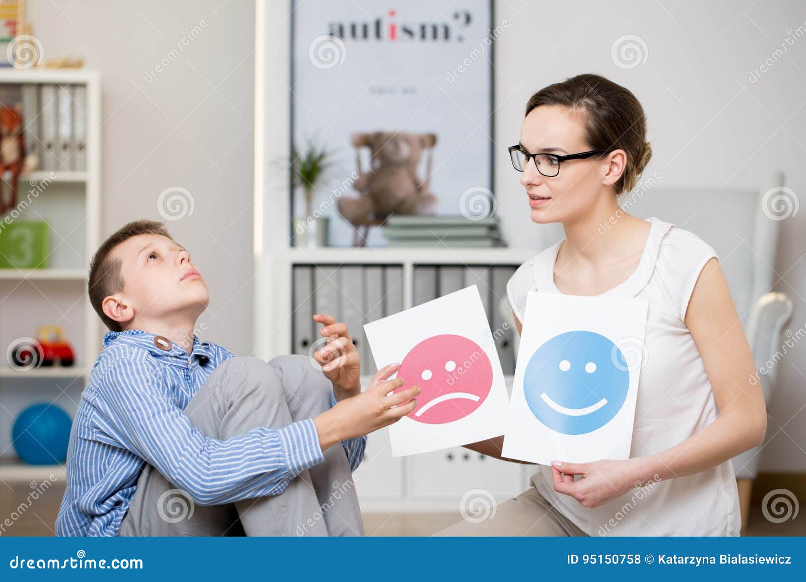 psychologist working with autistic boy