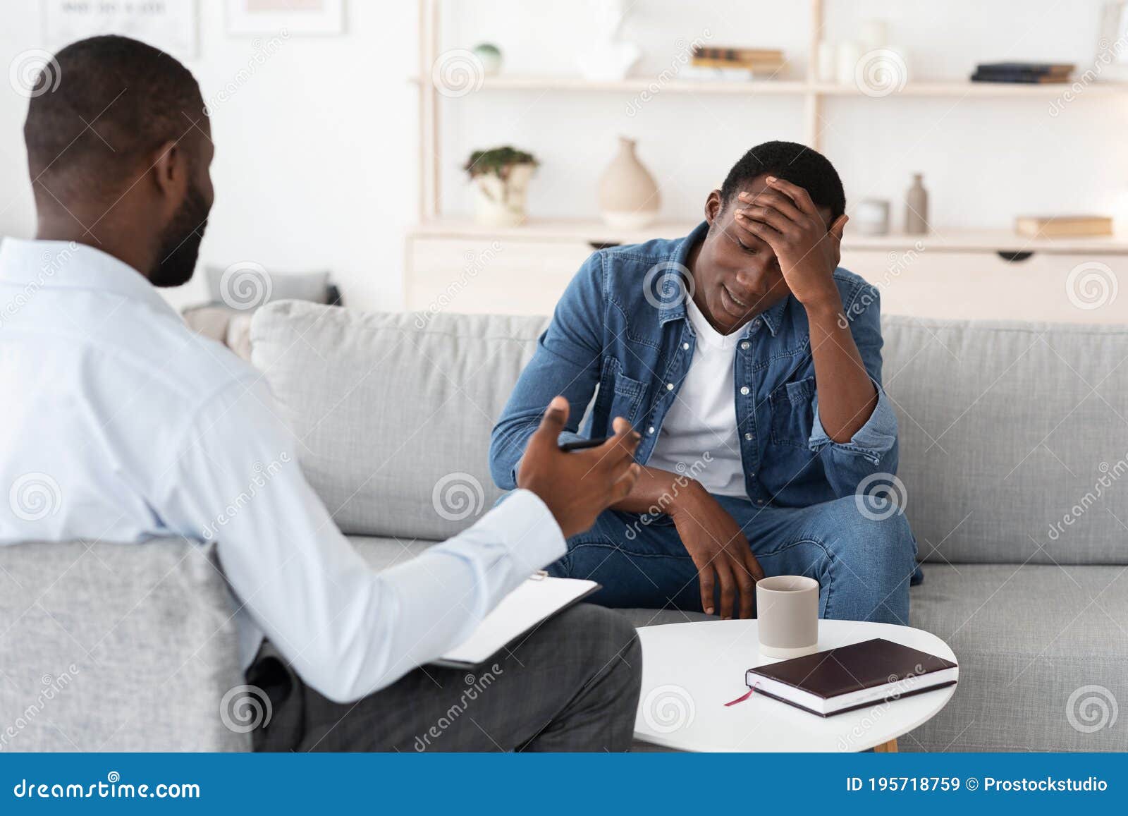 psychotherapy concept. depressed black man talking to psychologist during individual therapy