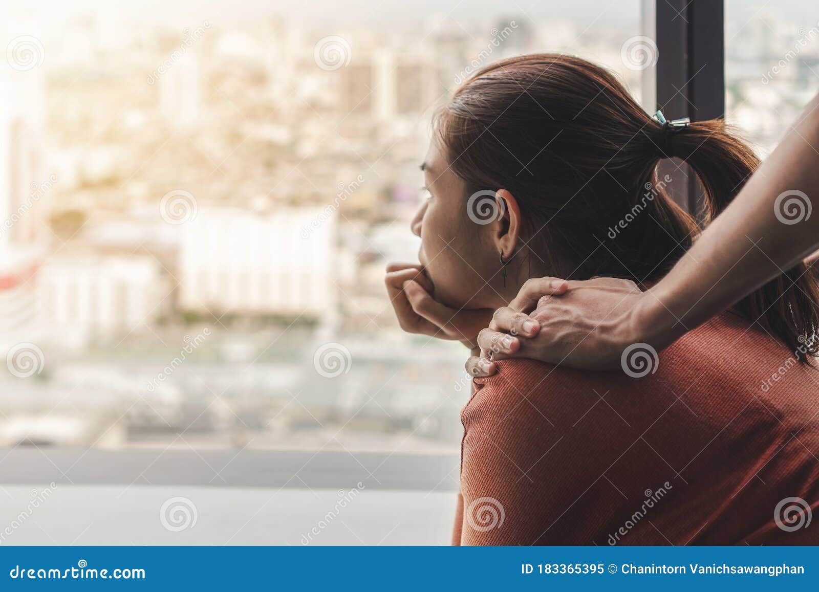 ptsd mental health concept, psychologist sitting and touch young depressed asian woman for encouragement near window with low