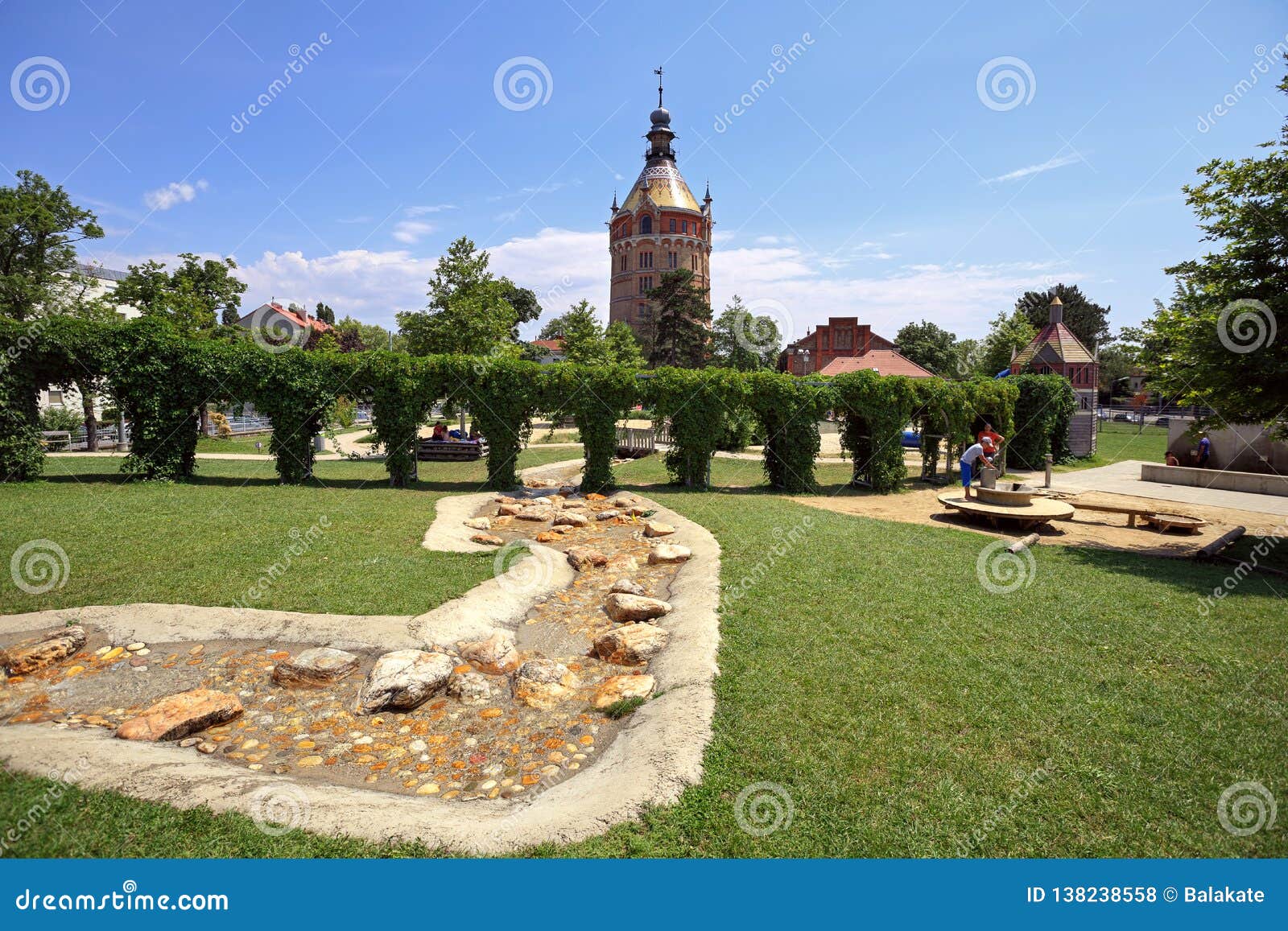 Public Park And Playground For Children In Front Of The Old Water