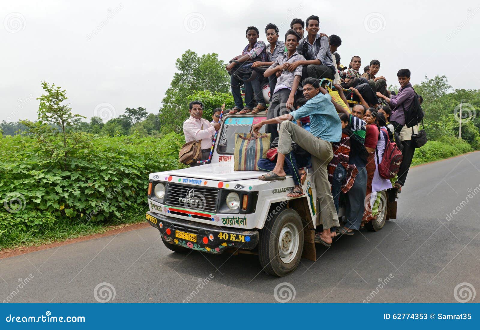Stock photo of Typical rural transport, overloaded van with people, Maharashtra, India. Available for sale on