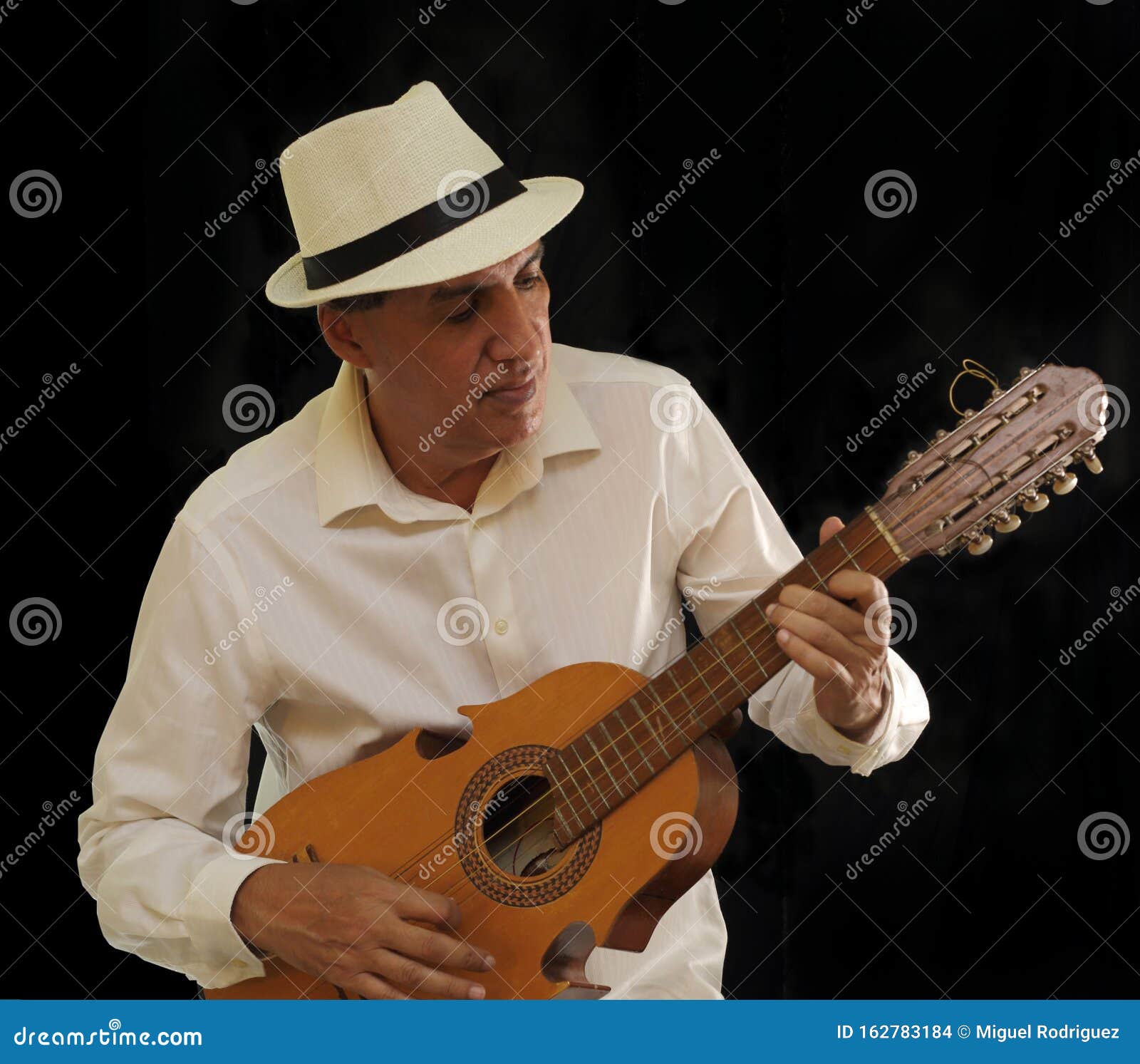 puerto rico cuatro player with a panama hat.