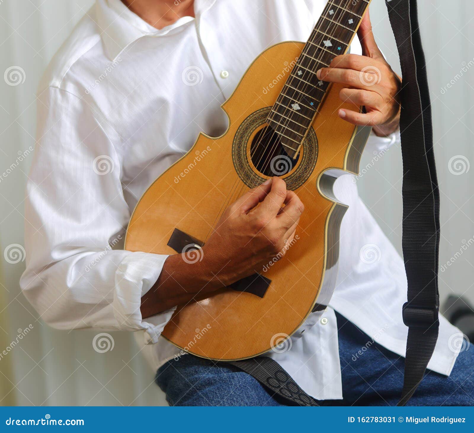 puerto rico cuatro player with white shirt.