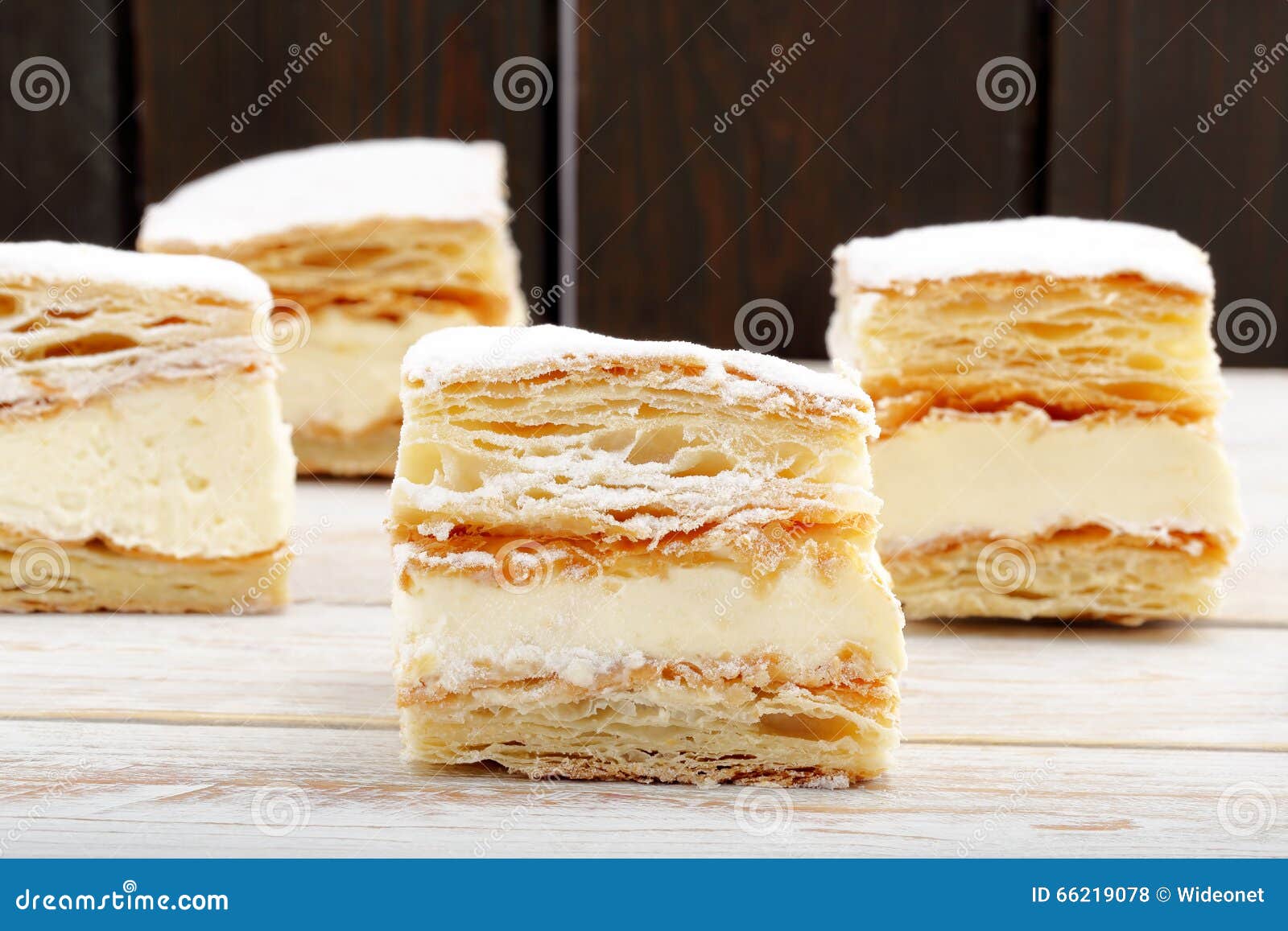 Puff Pastry Cake with Cream and Powdered Sugar. Stock Photo Image of