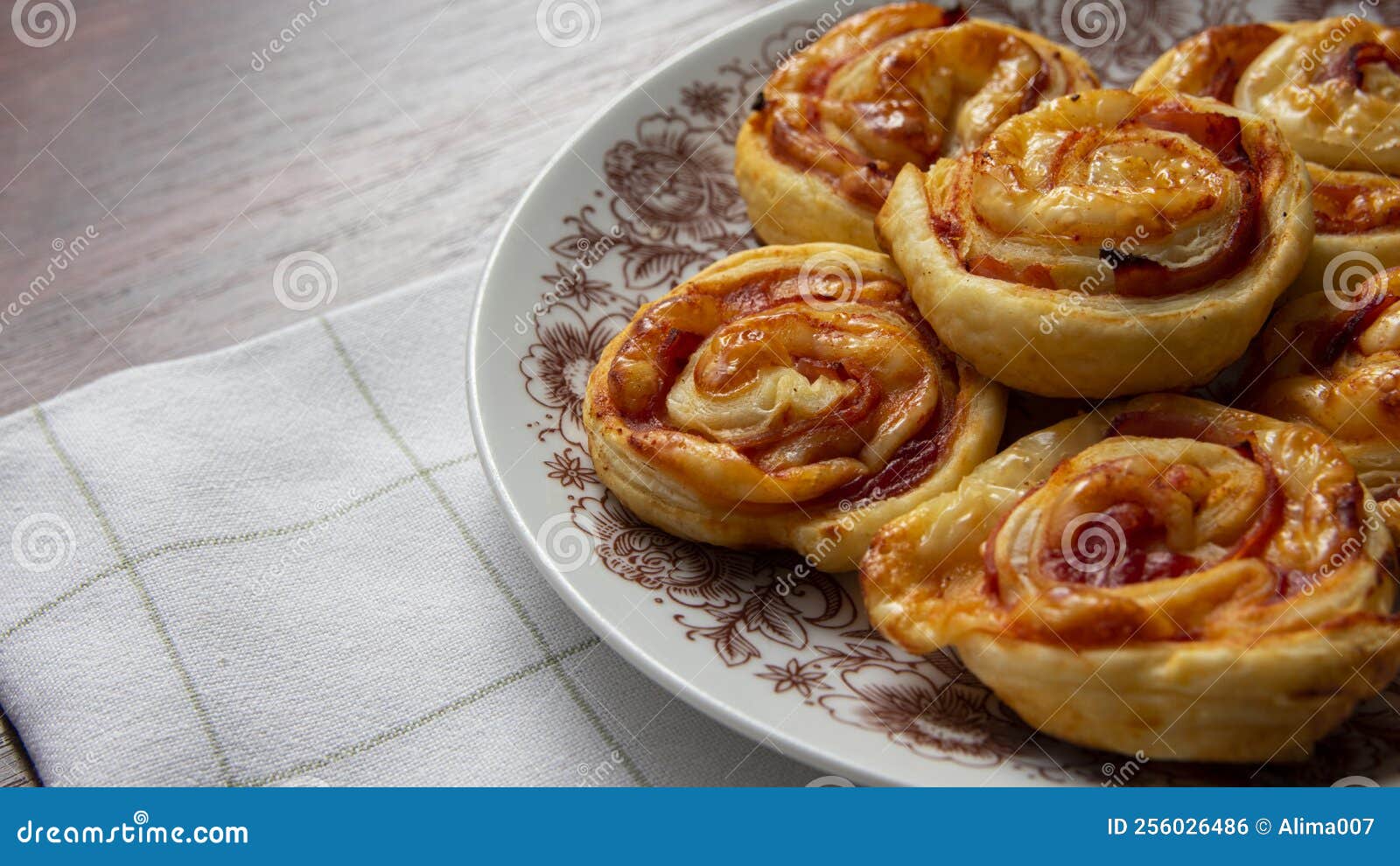 Puff Pastry Snails, with Cheese and Ham on a Plate Stock Photo Image